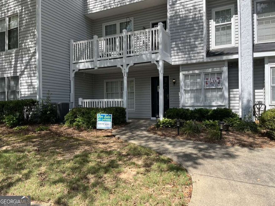 Charming, ground level, move-in ready condo. Easy living on one floor from the front porch to a large living room w/gorgeous fireplace and the spacious bedroom. Includes a bath suite w/ walk-in closet. Steps to the pool and gazebo, short walk to Laurel Park (25 acres of green space, tennis courts, duck ponds, track and playground). Low monthly HOA fees of $179.61 (plus $200 annually) which includes trash, water, exterior maintenance, pool, and common grounds maintenance. Excellent Marietta location!