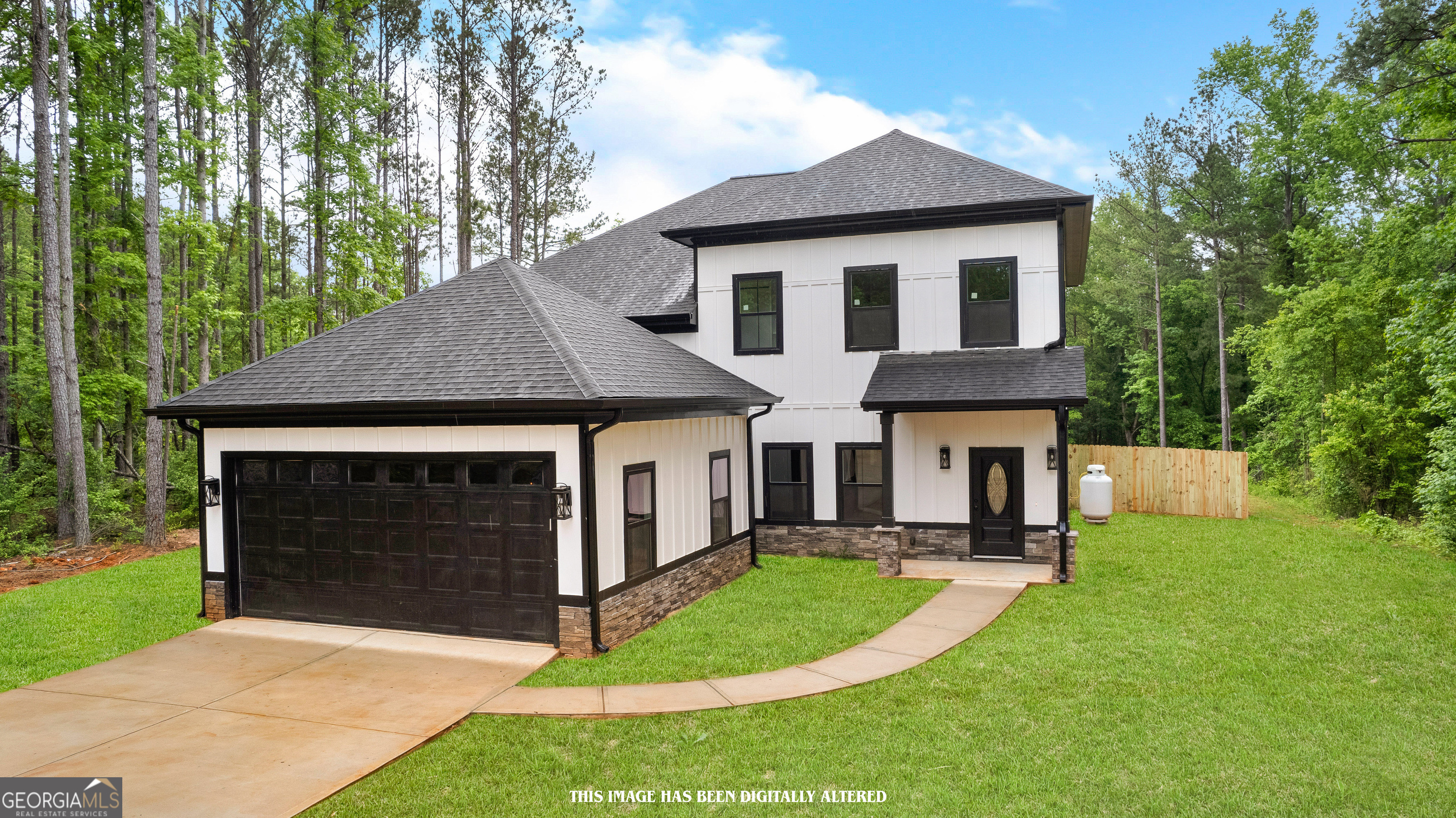 Step into this luxurious almost new home in Fairburn!! Boasting 5 bedrooms and 3.5 baths, this residence is thoughtfully designed with the master suite conveniently located on the main level. As you step inside, you're greeted by an inviting open-concept layout, featuring stainless steel appliances, a large island with shaker cabinets, a double oven, hardwood flooring, and a stylish hood vent in the kitchen. The living space is adorned with recessed lighting and a charming chandelier, creating an ambiance of warmth and elegance. A beautiful statement fireplace graces both the living room and the master bedroom, adding a cozy touch to these spaces. The master ensuite is a retreat in itself, complete with a double vanity, a separate soaking tub, an oversized shower, and a spacious walk-in closet. Upstairs presents with an additional Master and en suite, secondary bedroom, and a bonus bedroom with a wet bar serving as an ideal entertainment area, perfect for gatherings and leisurely moments. Outside, an extra-large fenced yard provides ample space for outdoor activities and relaxation, while a covered patio offers a perfect spot for al fresco dining or lounging. Do not worry of the heat, as two ceiling fans are installed on the lanai for your comfort! With its thoughtful design, modern upgrades, and charming details throughout, this new construction home is a perfect blend of functionality and style, promising a lifestyle of comfort and enjoyment for its fortunate residents. Located centrally of Landmark Christian, The Heritage School, & Chattahoochee Hills Charter School!