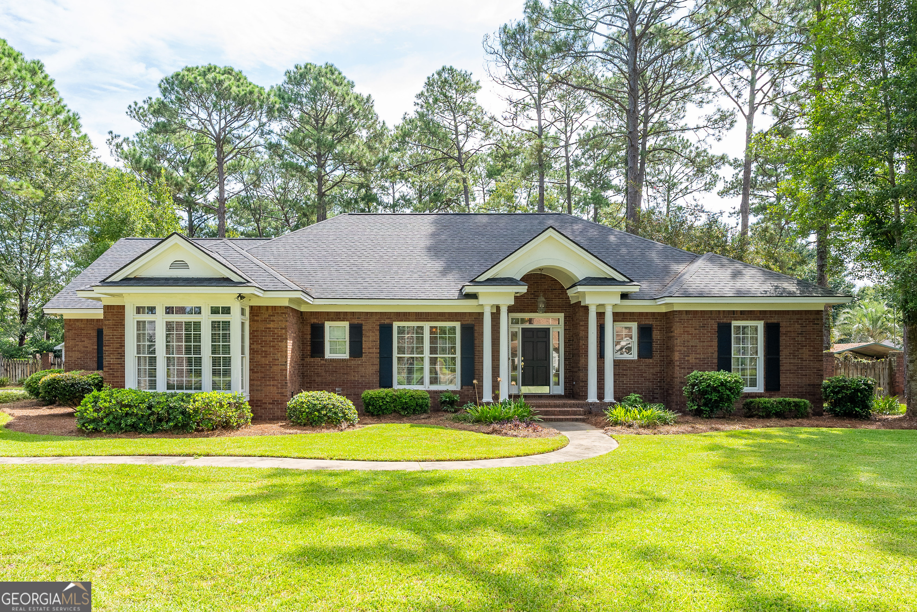 Classic Southern Charm in Lynn Woods Welcome home to this full brick, 3-bedroom, 2-bath beauty with a large bonus room and split floor plan in the highly desirable Lynn Woods subdivision-a beautifully maintained neighborhood in the heart of Waycross. Step inside to a grand foyer that opens into a spacious living room featuring built-in cabinets and a marble fireplace. Off the living area, you'll fall in love with the sunroom-lined with wall-to-wall windows that flood the space with natural light and overlook the charming backyard. The kitchen is a true highlight with white cabinetry, quartz countertops, a bar seating area, breakfast nook, and a formal dining room-perfect for holiday gatherings. The owner's suite is a retreat with large picture windows, a walk-in closet with built-ins, and a spa-like bath complete with jacuzzi tub and separate shower. Other features include: * Split floor plan for added privacy * Full brick construction * Roof less than 5 years old * Luxury vinyl plank flooring * Oversized 2-car garage * Large laundry room * Back deck off the sunroom * Beautifully landscaped yard * Fully fenced backyard with cottage-style storage shed featuring its own adorable front porch The yard is a true show-stopper, offering both landscaped beauty and Southern charm from front to back. This home has it all-style, space, and an unbeatable location in Waycross.
