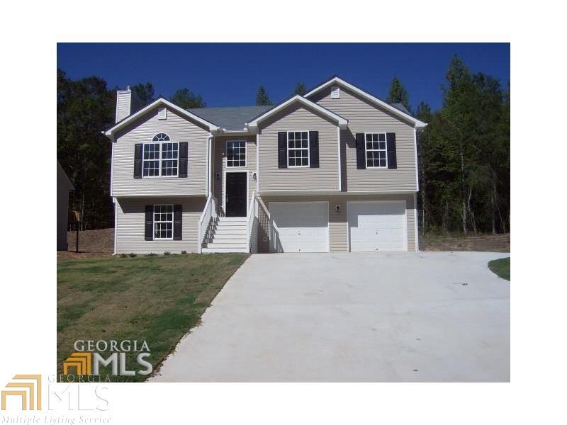 South Hall New Construction. 5.76 acres- Split foyer features large great room with fireplace and vaulted ceiling. Kitchen has custom raised panel cabinets, smooth top stove, built-in microwave and dishwasher. Master bedroom has trey ceiling, separate shower and garden tub. Upgraded lighting package. Room to grow with unfinished lower level stubbed for bath. Concrete patio off the lower level. Deck off the kitchen area. Two car garage. Sodded front yards. This home qualifies for 100% financing.