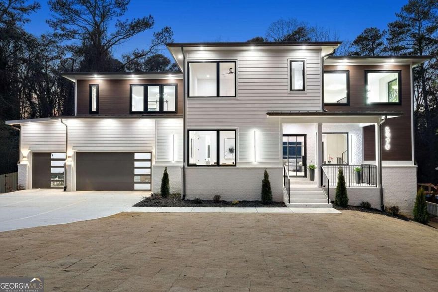 Don't miss out on the incredible opportunity to own this beautifully designed dream home nestled on a spacious 0.537-acre lot in the sought-after Hammond Hills neighborhood of Sandy Springs. Boasting an exceptional indoor/outdoor living space, this residence is a haven for those who love to entertain. The expansive open layout encompasses a versatile study/bedroom with a full bath, a generously sized family room, a covered outdoor lounge, a chef's kitchen, a mudroom, and a convenient 3-car garage. Inside, you'll discover a blend of luxury features, including high ceilings, oversized windows, wide plank hardwood flooring, designer lighting, custom cabinetry, and contemporary finishes. The chef's kitchen is a culinary delight, equipped with top-of-the-line stainless steel appliances, custom cabinets, quartz countertops, a spacious island, a meticulously designed walk-in pantry, and an open dining room perfect for entertaining. Step into luxury with the primary suite of this exceptional dream home. This sanctuary on the second level is a true retreat, offering an unparalleled level of comfort and sophistication. The spa-grade bathroom features featuring high-end fixtures, a spacious walk-in shower, a luxurious soaking tub, and designer finishes that create a serene atmosphere. There is also a loft area and three sizable bedrooms each with private ensuites to complete the upper floor. Beyond the lavish interiors, step outside to discover the expansive and inviting backyard that complements the grandeur of this dream home. Whether you envision hosting lively gatherings with friends and family or prefer quiet moments of serenity, this outdoor haven accommodates both. The sizable lot allows for the creation of customized outdoor spaces, such as a lush garden, a play area, or outdoor kitchen. Situated in the heart of Sandy Springs, this prime location offers unparalleled convenience, with easy access to I-285, Ga-400, Perimeter Mall, Northside Hospital, and Sandy Springs City Center. Don't let this opportunity slip away to own a home that combines elegance, functionality, and an ideal location.