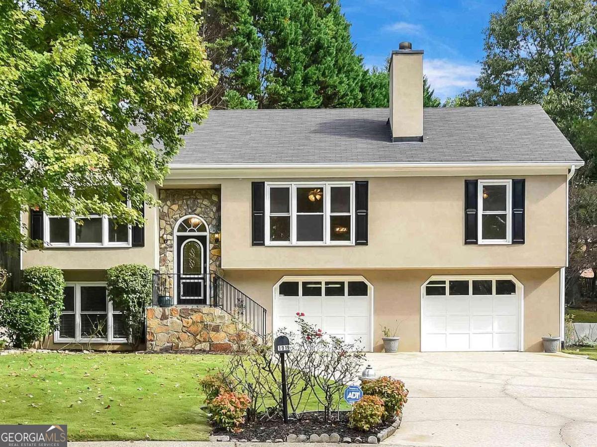 Spacious 4-Bedroom Home with Bonus Rooms in East Cobb's Top-Rated School District! Welcome to your perfect East Cobb rental-located in a quiet cul-de-sac and zoned for all 10/10-rated schools! This beautifully updated home blends comfort, function, and style, offering everything you need and more. Step into a bright and open layout featuring a large living room with a cozy fireplace, a separate dining area, and an additional family room-ideal for gatherings or quiet evenings. The kitchen boasts granite countertops and stainless steel appliances, perfect for cooking and entertaining. This home also includes a very large, versatile sunroom/flex space. This split-level home has a bedroom, a closet, and half bath in the basement, which can be converted to an office, playroom, gym, or guest suite. Enjoy your morning coffee or host summer barbecues on the expansive wraparound deck overlooking a private, landscaped backyard oasis. Freshly painted deck. Additional highlights: Washer & dryer included Fresh paint on deck and hardwood floor Wider-than-standard 2-car garage (fits like a 3-car!) Ample storage space Top East Cobb schools: all rated 10/10! With 4 spacious bedrooms and multiple flexible living areas, this move-in-ready home truly has it all. Don't miss your chance-schedule your tour and make this stunning rental yours today! The tenant pays for lawn care.