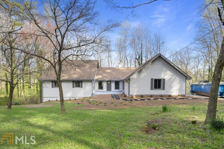 Welcome home to this beautiful 4/2 on full basement & bonus room on upper level. Step into the gorgeous great room w/ fireplace. Kitchen w/ granite, tile back splash & eat in area. Huge bright & airy all season sun room that overlooks Upper Mill Creek. Sep. dining room. Main level master bedroom w/ large attached bath & 2 more generously sized bedrooms & full bath. Full unfinished daylight walk out basement. Private yard & deck. Huge nearly 2-acre private lot close to shopping and schools.