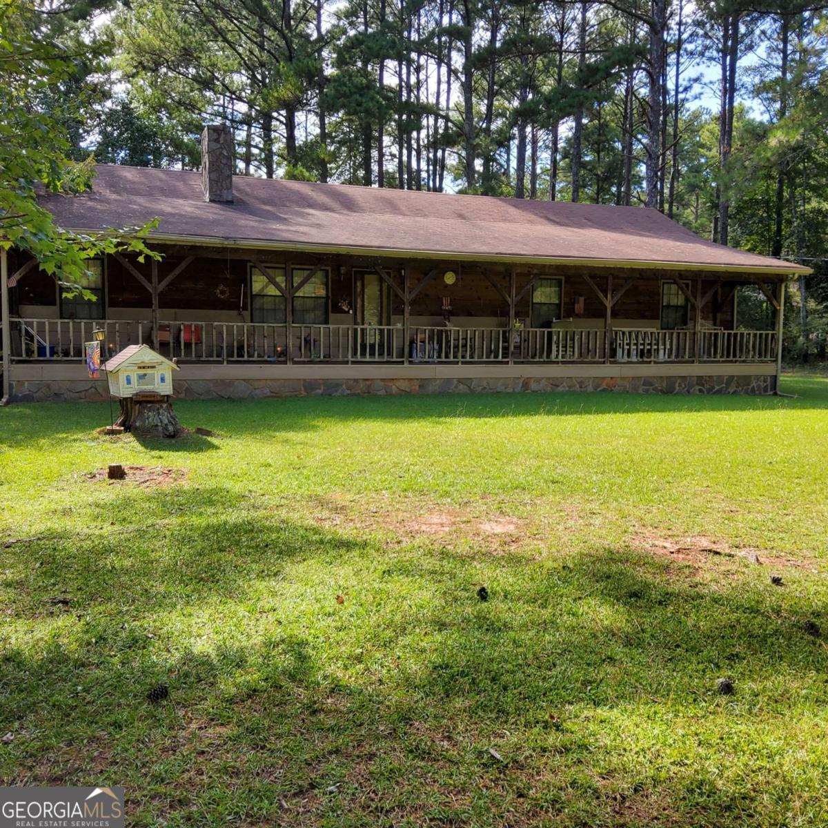 Hidden Gem - Just two minutes from East Lake Rd & Hwy 155 (Please read futher for details). More pictures coming soon for an estate sale. The photos here doesn't show the beauty of this home. More photos coming soon. This amazing 4-bedroom, 3 full-bath home sits peacefully on nearly 2 acres in a quiet cul-de-sac community of only 11 homes, each on large one-acre-plus lots. Perfectly located only a one minute drive from "Salem Baptist Church" and great shopping, schools and dining. This home offers the rare opportunity and combination of inside and outside usable level-space. The small community is very peaceful, and convenience to everything and it has wonderful value. This home was built by the original owner, a professional construction engineer by trade. This one-of-a-kind property was crafted with durable "cedar wood" and showcases quality craftsmanship throughout. Over 1,900 sq. ft. of living space, you'll enjoy the double-sided fireplace, like-new carpet throughout, four spacious bedrooms with walk-in closets and ceiling fans, and a unique 4-foot-wide hallway that sets this home apart. The roof was replaced around 2011- 2013. The HVAC unit, water heater, and the AC unit are relatively new and in good working conditions. The septic system were serviced and pumped in 2024 with receipts for buyers if wanted. Step outside onto your rocking-chair front porch, the perfect place for family to relax with a hot cup of coffee, or cold glass of sweet tea. It's the perfect place and setting to catch-up on reading a good book. Walk the grounds and enjoy new flowers, and lots of room to establish your own flower beds out front and around the home. The backyard has just the right touch and feel for family gathering or private enjoyment. There's enough room for your garden area, a desired inground pool, a patio and umbrella setting. You could build a gazebo, pergolo, pavilion in seperate spaces and still have room for a playground. All this is on level grounds and that's a very rare find in todays market. This is No hype, just a good setting for a family ready to settle down in a quite community. You will not be surprised. There's more: This home has a huge oversized detached "4-car garage" that will easily fit 4 large SUV's and much more. The garage includes an upstairs storage space with flooring and attic fans. A new genie remote control door system have been installed. In addition to this, there's an additonal huge attached enclosed storgae room, or make it a workshop, man cave or arts and crafts room. In addition to this, attached on the side of the garage is covered boat/RV parking area. Best of all, there's NO HOA and NO CITY TAXES - giving you the freedom and privacy to grow and enjoy life in a quite setting peaceful setting. Thank you for your interest.