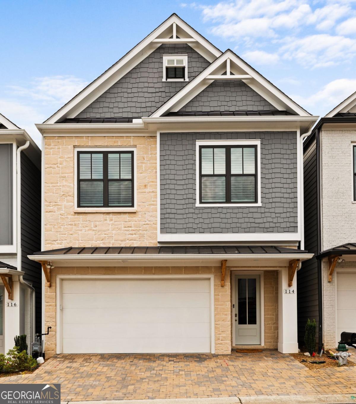 Do not miss out on an amazing opportunity to have it all! Located less than 5 minutes from downtown Woodstock, this nearly new home has all the futures you want. Located in the Villages at Towne Lake, this 3 bedroom, 2.5 bath home welcomes you with beautiful flooring, tall ceilings, and grand sized windows. The kitchen gives off designer vibes with stainless steel appliances, a herring bone backsplash, and quartz countertops. The large island looks onto the living and dining area making this home an amazing place to host friends and family. Upstairs you will find the three bedrooms. The two secondary bedrooms feature large windows and ample sized closets. These bedrooms share a guest bath with a large vanity and tub/shower combo with tile surround. The owners suite features an amazing custom closet, elegant bathroom with walk-in shower, his-and-hers vanities, and modern tile details. There is even a private covered deck. Located in a beautiful gated neighborhood, this private enclave of homes give off a Mediterranean feel and features top class amenities, including a large pool, tennis courts, private work out center, covered sitting area around the pool, and a club house for resident use. You don't even have to cut the grass as it's all included in the HOA dues. Schedule your showing today and see what its like to live the high life.