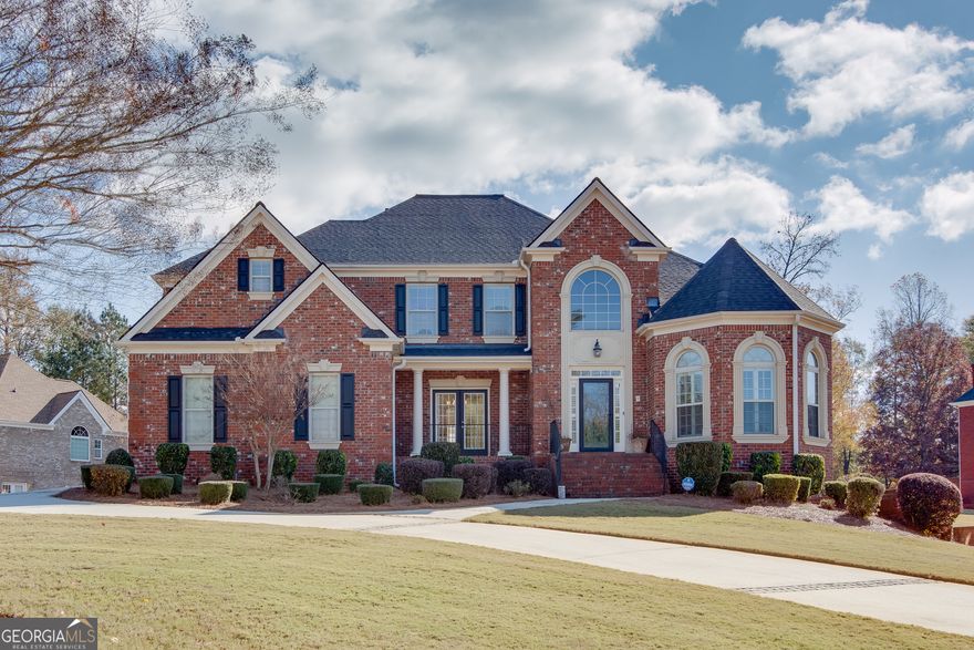 Stunning 4-Bedroom, 4.5-Bath Home on a Corner Lot - More than 5,000 Sq. Ft. of Luxury Living!    Welcome to this exceptional residence that perfectly blends elegance, comfort, and lake-community living. Nestled on a desirable corner lot, this impressive nearly 6,000-square-foot home offers a spacious and flexible floor plan with the primary suite conveniently located on the main level.    Step inside to discover soaring ceilings and abundant natural light. The gourmet kitchen is a chef's dream, featuring modern appliances, spacious cabinetry space and dining areas-perfect for entertaining or family gatherings. The main-level primary suite provides a serene retreat with a spa-inspired en-suite bath and a generous walk-in closet.    The fully finished basement is designed for both comfort and entertainment, complete with a full second kitchen, theatre room, and a full bathroom with a shower-ideal for guests, in-laws, or hosting movie nights.    Outside, enjoy the beautifully landscaped yard and deck space, perfect for relaxing or entertaining.     With ,5212 square feet of thoughtfully designed living space, luxury finishes, and access to serene lake amenities, this home offers the perfect combination of sophistication, comfort, and lifestyle.