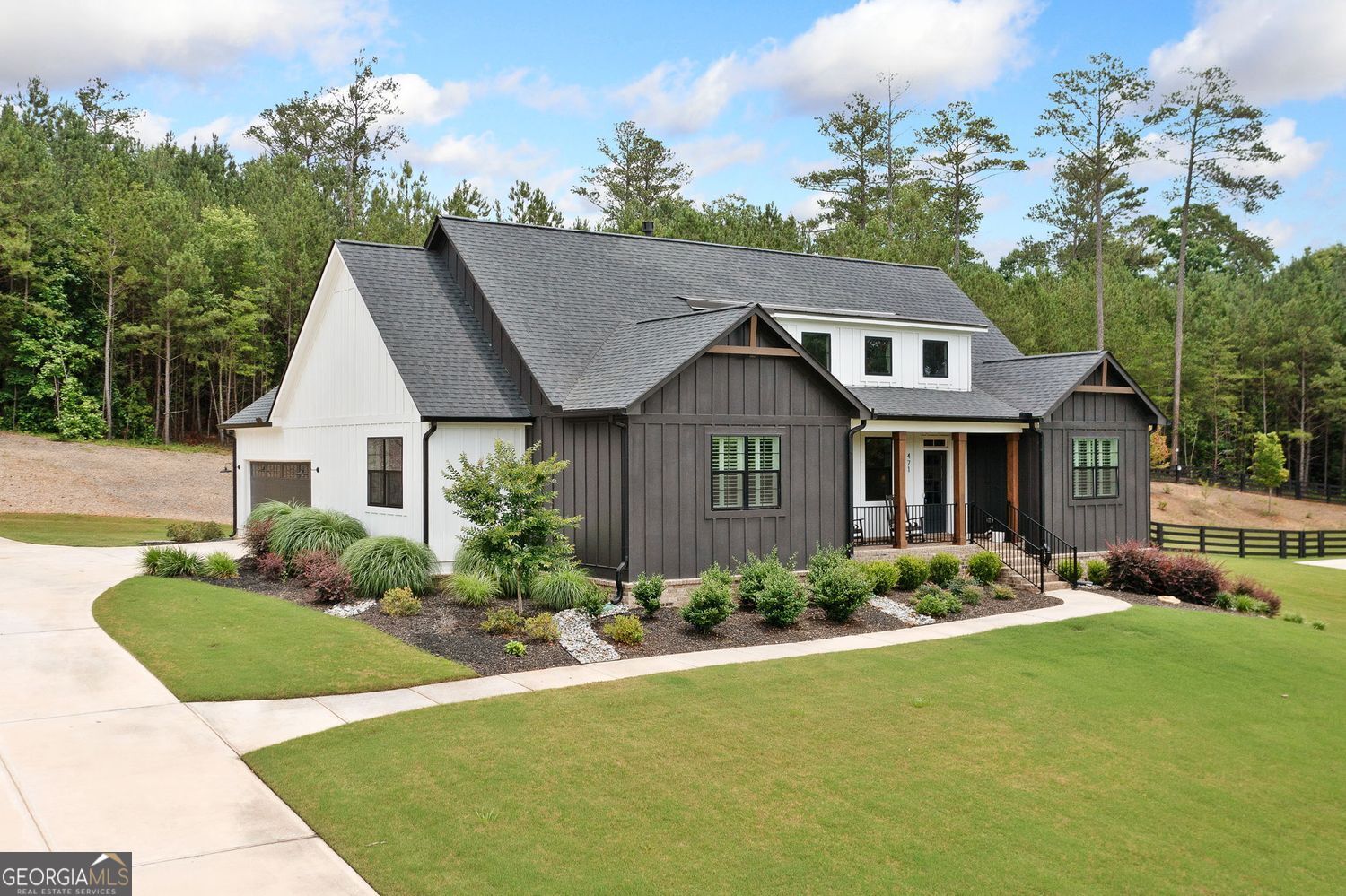 Welcome to 471 London Road! A beautiful modern farmhouse offering comfort, privacy, and easy one-level living. Located in a gated, private community in Ball Ground, GA, this 3-bedroom, 2-bath home was built in 2022 and sits on a spacious 1.51-acre lot that backs up to trees, providing maximum privacy. The bright, open floor plan features hardwood flooring, granite countertops, stainless steel appliances, and a large kitchen island that flows seamlessly into the living and dining areas-ideal for entertaining or relaxing at home. The spacious primary suite includes a walk-in closet and a spa-like ensuite with a tiled walk-in shower and dual vanities. Two additional bedrooms provide flexible space for guests, a home office, or family. Step outside to your covered back patio with a full outdoor kitchen-perfect for grilling and entertaining while watching the birds and enjoying the blooming magnolia tree. Meticulously maintained and like new, this home sits on one of the best lots in the neighborhood, with plenty of space to add a detached garage, workshop, or even a guest suite. Perfect for someone starting a family, downsizing, or trading up, this property offers versatility and long-term value in a quiet and private community. Enjoy peaceful country living with all the modern touches-conveniently located near downtown Ball Ground, Canton, Jasper, and with easy access to I-575. Don't miss this rare opportunity for one-level living on a prime lot in a gated community. Schedule your private showing today!