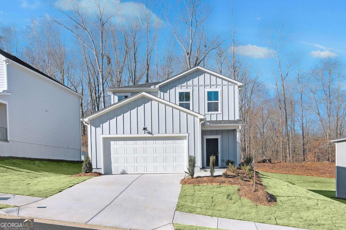 Move-In Ready! This stunning new construction home is designed for comfort and convenience, featuring a privately tucked-away guest suite on the main level, a stylish L-shaped kitchen with granite countertops, and a spacious island overlooking the open living room. Upstairs, enjoy a versatile loft perfect for a second living area, office, or playroom. Step outside to your wooded backyard with a privacy fence-an ideal retreat for relaxing or entertaining. Thoughtful finishes throughout add a touch of modern elegance to every space. The Avery Ridge community offers fantastic amenities, including a swimming pool, cabana, and sidewalks for easy strolls. Nestled in a scenic, wooded setting, Avery Ridge feels peaceful and private while still being just minutes from downtown Gainesville's shopping, dining, and entertainment. With quick access to I-985 and Athens Hwy, commuting is a breeze!