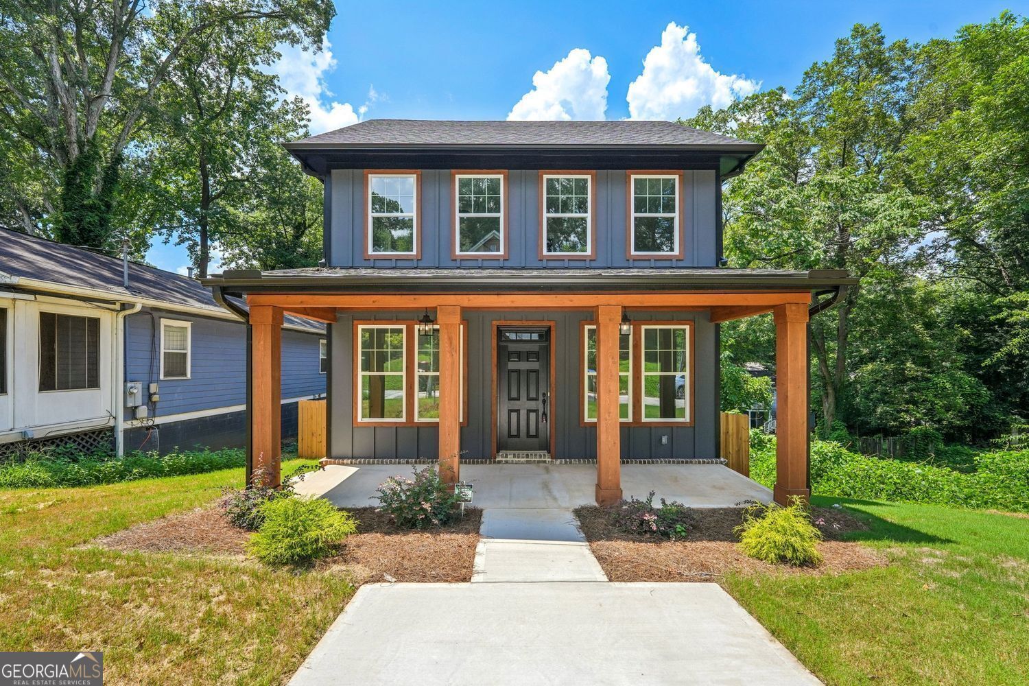 This brand-new modern Craftsman-style home with a full daylight basement offers over 3,000 square feet of beautifully designed space in the heart of the Pittsburgh neighborhood-one of the fastest-growing areas near downtown Atlanta. With 4 bedrooms and 3 full bathrooms, this home is perfectly suited as a primary residence or a long-term buy-and-hold investment opportunity. The main floor showcases 9-foot ceilings, a flexible living room ideal for an office, a guest bedroom with full bath, and a formal dining room with coffered ceiling. The open-concept kitchen features a large island, walk-in pantry, quartz countertops, and flows into a bright family room with a cozy fireplace. Enjoy seamless indoor-outdoor living with access to a spacious covered deck and a private, fenced-in backyard-ideal for relaxing or entertaining. Upstairs, the owner's suite features a tray ceiling, HIS and HER walk-in closets, and a spa-inspired bathroom with an oversized glass-enclosed shower and double sinks with quartz countertops. Two additional bedrooms share a full bathroom with double sinks for added convenience. Other highlights include a full daylight basement, tankless water heater, and a security system. Just minutes from Pittsburgh Yards, a 31-acre mixed use community development project, and southside entrance of the BeltLine Trail. Close to Mercedes-Benz Stadium, Summerhill, and The MET, this home offers incredible access to Atlanta's urban core while nestled in a dynamic and growing community.