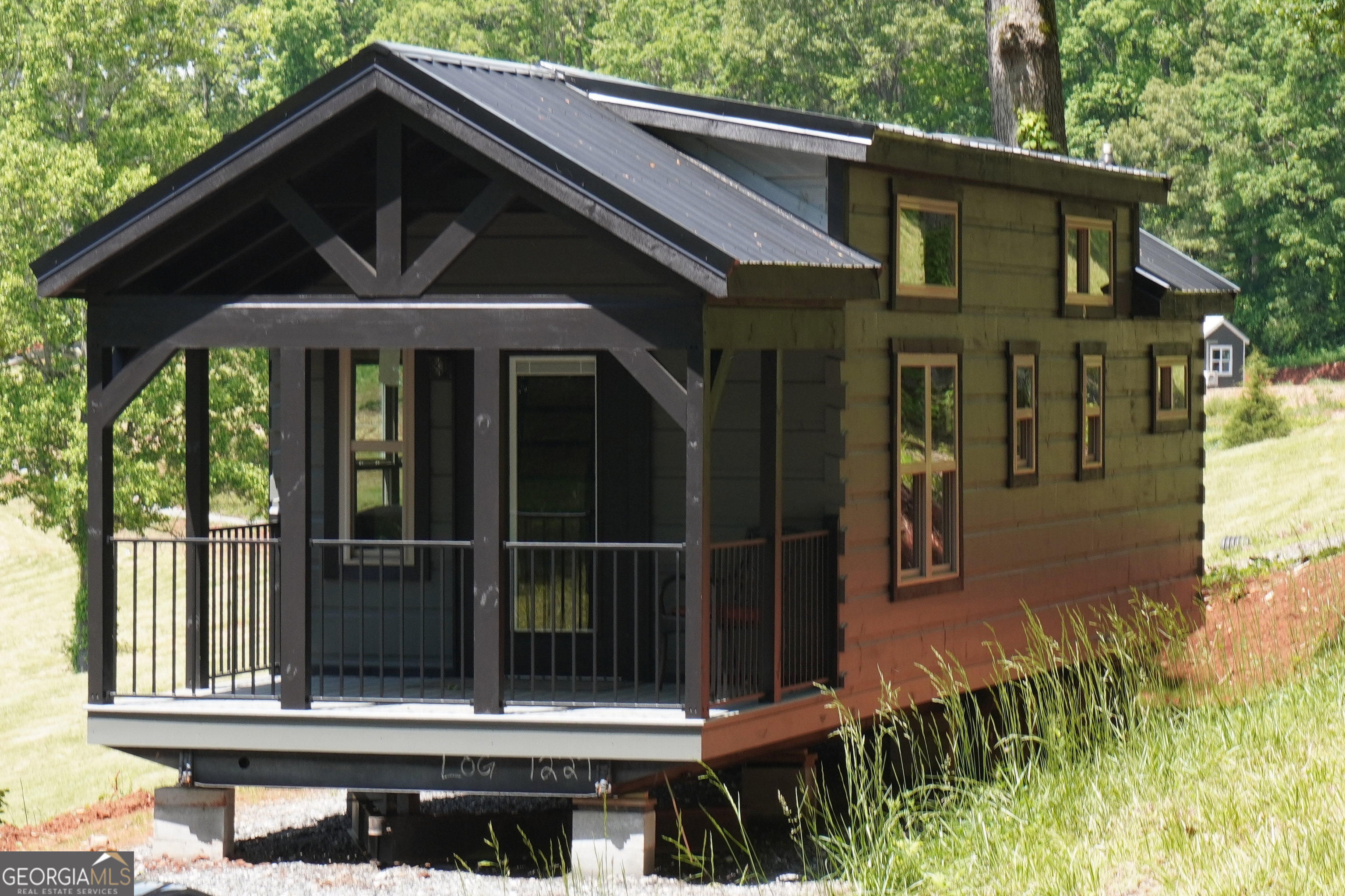 Turnkey 2024 "Smoky" Model tiny home on 0.33-acre- Lot #25 This 397 sq ft, 12' x 44' park model features 1 bedroom, 1 bath, and a loft-comfortably sleeping up to 6. Modern design, efficient layout. Peaceful Meadows spans 28 acres and will feature 78 homes at completion. Residents enjoy a peaceful, community-oriented lifestyle with modern amenities including paved roads, water, septic, high-speed internet, and professionally maintained landscaping in shared green spaces. Future amenities under development include: * Gated entrances * Clubhouse with fitness room & pavilion * Picnic area * Pickleball court * Dog park Please note: Home is not available for occupancy until utilities are installed and final setup is complete-estimated move-in ready by early July 2025. Active construction site - use caution when visiting.