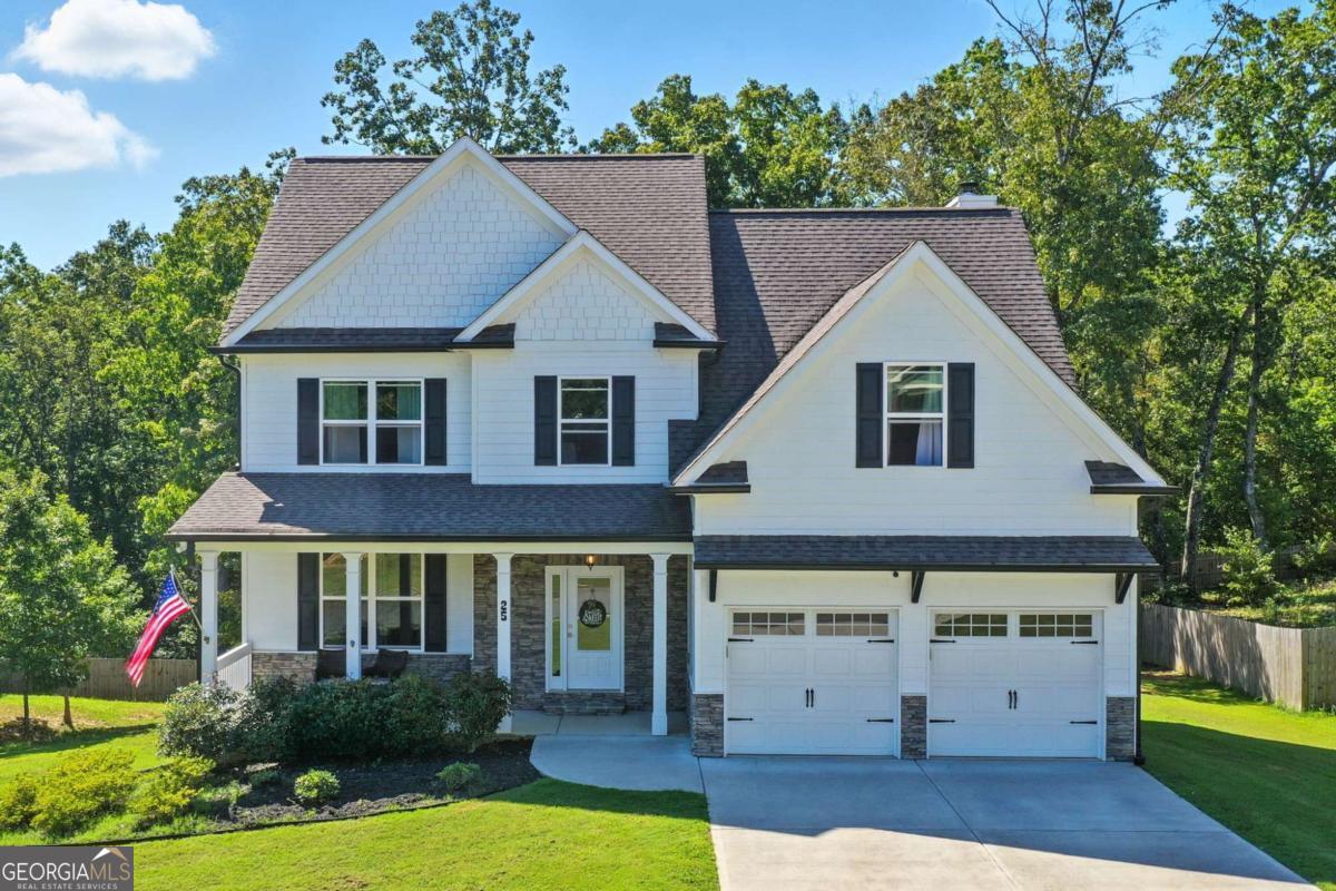 Welcome to this meticulously maintained 3-bedroom, 2.5-bath home with a versatile bonus room that can easily serve as a 4th bedroom. Offering 2,696 square feet of open-concept living, this home features engineered hardwoods throughout, a spacious family room with a stacked stone fireplace, and a tongue-and-groove accent wall that adds warmth and character. The chef's kitchen is equipped with stone countertops, a large island, upgraded stainless steel appliances, and a walk-in pantry, while the adjacent dining room is perfect for entertaining. Natural light and cool breezes pour in through walls of windows, creating a bright and inviting atmosphere. Step out to a tranquil covered and screened patio for leisure mornings or an open deck ideal for weekend grilling. Upper level boasts an oversized primary suite, walk-in closet, luxurious ensuite bath with double vanities, designer and subway tile. Two additional spacious bedrooms, a full bath with double vanity, and a bonus room that offers excellent flexibility. The full unfinished terrace level provides endless potential with workshop space, a studded bath, safe room area, generator hookup, abundant storage, and a walkout to a covered lower patio. The spacious backyard offers plenty of room to bring your vision to life, whether it's a garden or outdoor retreat. This home truly has it all: thoughtful upgrades, flexible spaces, and room to grow. A rare find that combines comfort, craftsmanship, and future potential! Special features include upgraded ceiling fans, sealed garage floor, High-efficiency toilets, Generator hookup installed. Come make this your forever home.