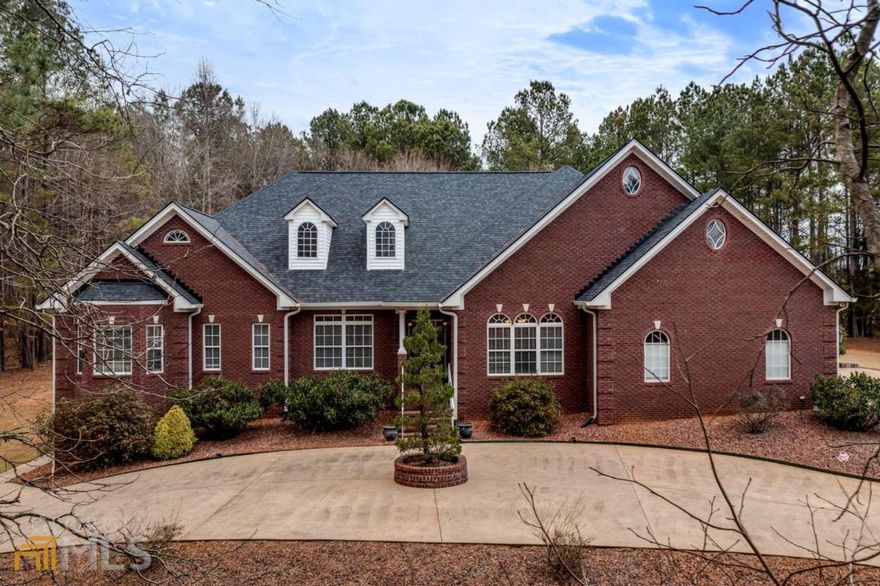 Custom built RANCH on 2.26 acres! This home is gorgeous both inside and out and is located across from a private lake inside the prestigious Antrim Glen subdivision. This 4 side brick home boasts a long wrap around drive-way that leads to a 3 car over sized garage that WILL fit your truck! Breathtaking panoramic lake views from almost every room. Stroll through the grand entrance into the foyer opening into the huge formal dining room and drop dead gorgeous great room with soaring ceilings, sensational fireplace and wall of windows viewing the backyard. The gourmet Chefs kitchen boasts superb stained custom cabinetry, stainless appliances, granite, breakfast bar, stunning breakfast room with windows galore, open view to family room and a to die for walk in butler's pantry. Exquisite trim, distinguished hardwoods and tasteful tile are abundant throughout. Owners Suite on the main features sitting area, private entrance to the back deck and incredible walk in custom closet. Enormous on-suite master bath boasts separate vanities, soaking jetted tube, large walk in tile shower. Two additional spacious bedrooms are located on the main floor with full bath a split bedroom plan, Upstairs is an oversized suite, walk in closet with private bath. A teenagers dream! The back entertainers deck and screened porch overlook the private backyard that features outdoor stone patio with  pergola that leads to the custom fire pit area.   Downstairs will NOT disappoint... Fully Finished Downstairs boosts a kitchen, recreation room with pool table, theater room with Home theater has a 75" Samsung smart TV with an Onkyo 780 watt, 7.1 surround sound system., fitness room, workshop, 5th bedroom with closet & full bathroom, all your needs can be accomplished right here. Additional upgrades and features are new roof, new carpet on main, new granite, new backsplash,  irrigations systems, light features, ceiling fans, surround sound -Main level contains integrated speaker system throughout, controlled by amplifier within entertainment center, with each room having its own volume controller. Upstairs area also has a separate integrated speaker system. Basement has integrated speaker system throughout with volume controllers in each room, driven by a separate Kenwood amplifier located in the entertainment center in the theater room.  This one of a kind property truly has it all and more!******FABULOUS WALK THROUGH VIDEO OF THIS PROPERTY****** request the  YouTube link by texting me or ask your agent to request a copy****