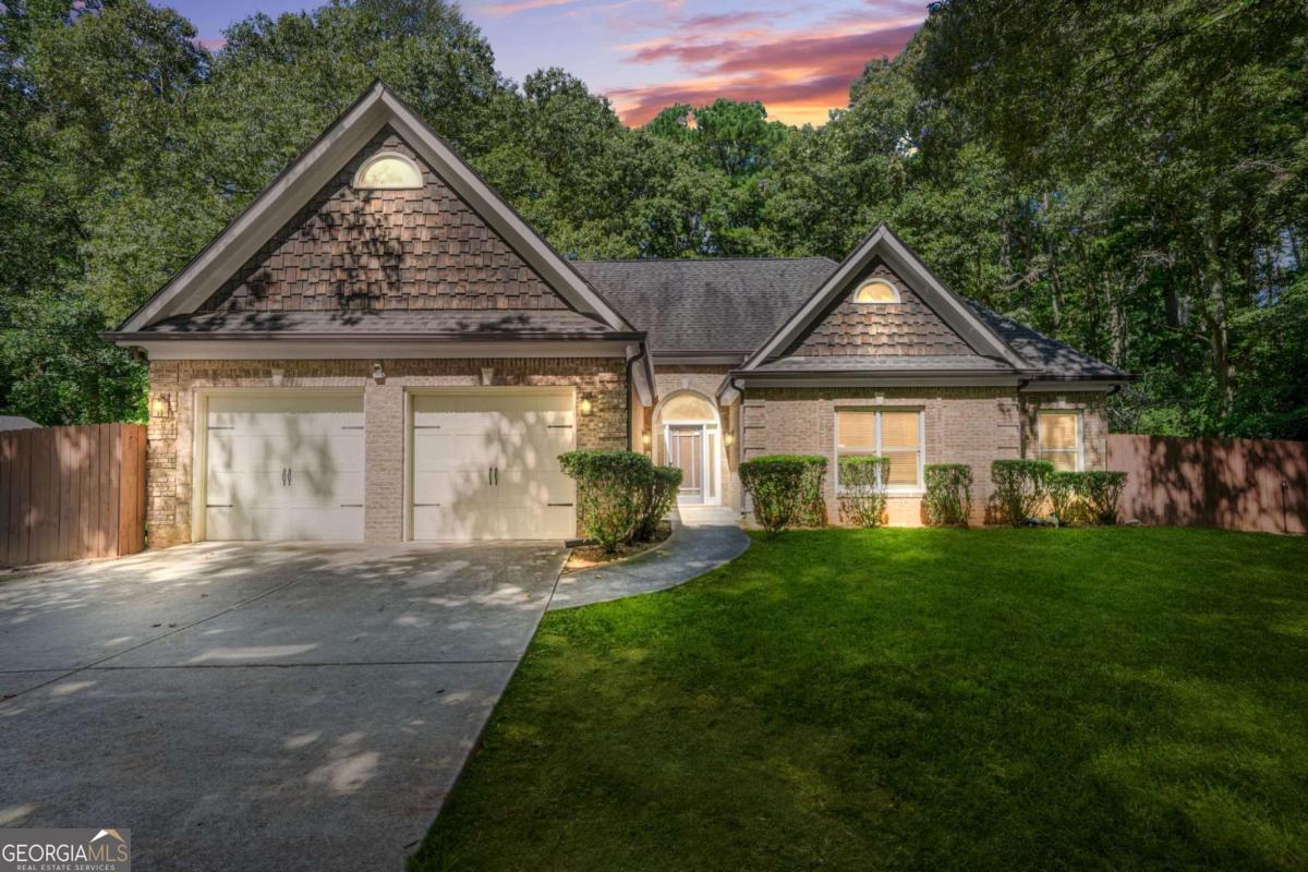 Welcome to 437 Stephenson Rd - Where Comfort, Style, and Convenience Meet! Step into this beautifully updated 4-bedroom, 2.5-bath home in the heart of Stone Mountain, just minutes from everything you need. With its open-concept floor plan, soaring two-story vaulted ceilings in the living room, and high ceilings throughout, this home delivers a spacious and airy feel perfect for modern living and entertaining. The recently remodeled kitchen is truly the heart of the home, featuring an oversized island ideal for gathering, quartz countertops, stainless steel appliances, and contemporary finishes that blend style with functionality. The updated bathrooms continue the theme of tasteful upgrades, including a luxurious soaker tub in the oversized primary suite, perfect for unwinding after a long day. Enjoy the best of indoor-outdoor living with a large backyard that's ideal for cookouts, kids, or pets. With four spacious bedrooms, there's plenty of room for family, guests, or a dedicated home office. Located in a well-established neighborhood, this home offers easy access to public transportation, and you're just minutes from I-285 and Hwy 78 - making your commute into Atlanta a breeze. You're also close to local shopping centers, grocery stores, parks, and Stone Mountain Village, along with an excellent selection of restaurants, cafes, and entertainment options. Whether you're looking to settle into a comfortable family home or want a move-in-ready space with designer touches, 437 Stephenson Rd checks every box. **Don't miss your chance to own this gem in one of Stone Mountain's most convenient and sought-after areas!**