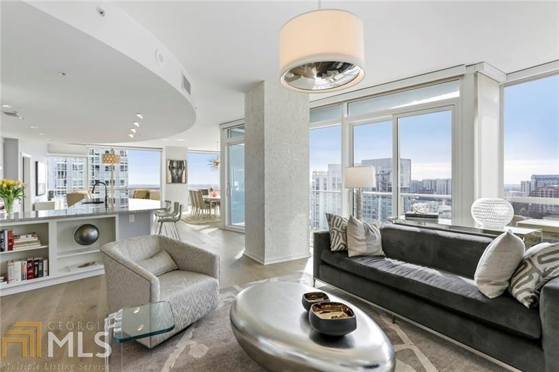 Beautiful corner unit, largest 3 bedroom plan, view of Stone Mountain, city skyline and Kennesaw Mountain. Sophisticated and spacious. Renovated chef's kitchen, new hardwood floors, floor to ceiling windows, and 2 separate terraces. Amazing views from every room. Master suite with sitting area, 2 walk-in closets, master bath with 2 separate vanities, whirlpool tub and separate shower. Two deeded parking spaces and 1 of only 30 storage rooms in building. World class amenities; 24 hr. concierge, valet, heated pool, fitness, club room, dog walk, entertaining rooms, media room, outdoor fireplace, guest suites and more. Perfect Buckhead location with easy access to 400, restaurants, & shopping.