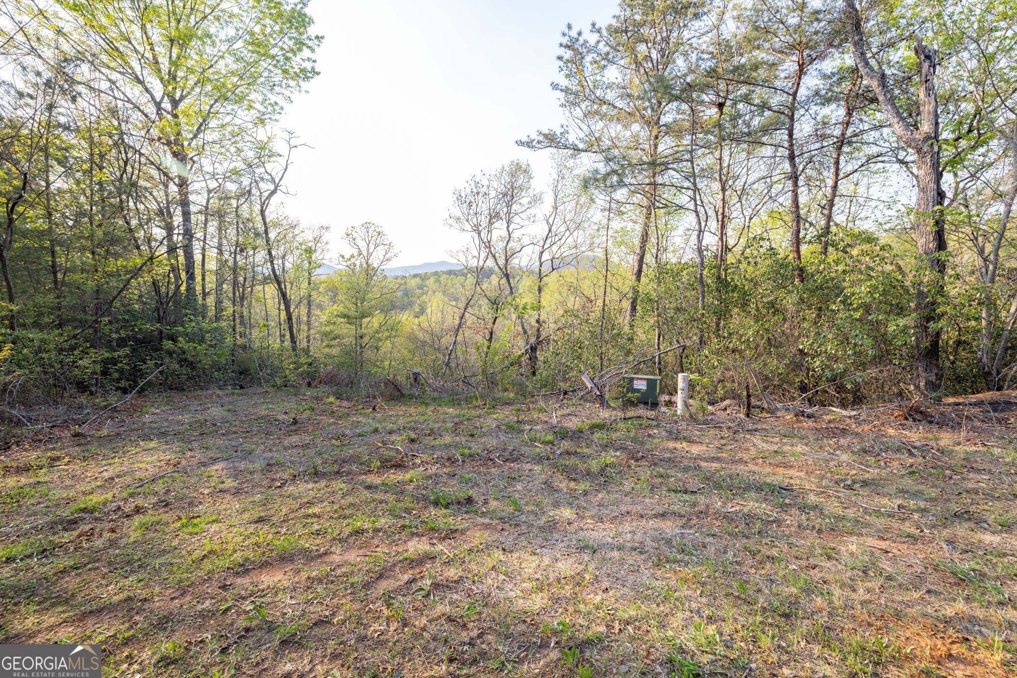 Looking for a place to build your dream mountain home? Look no further! This lot features a great building spot with 180-degree layered year round mountain views! Prime & private location - central to Helen or Clarkesville and features hardwoods & beautiful mountain laurel. Adjoining 21 acres can be combined for a total of 23.6 acres for even more privacy! See MLS #10512609.