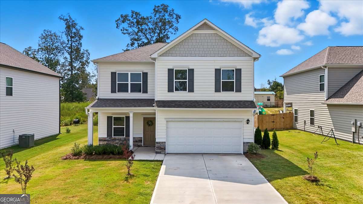 Welcome to Emerald Oaks, where 9-foot ceilings and thoughtful design meet a prime location in the Armuchee School District-just minutes from Berry College, Advent Health Baseball Stadium, shopping, and dining. This 4-bedroom, 2.5-bath home features an open main level with a spacious living room, dining area, and modern kitchen complete with an oversized island, shaker-style cabinets, granite countertops, coffee bar station, and pantry. A dedicated office and half bath add extra convenience. Upstairs, the oversized primary suite includes a walk-in closet, soaking tub with shower, and double vanity. Three additional bedrooms, a full bath, and the laundry room complete the second level. Step outside to a beautifully landscaped backyard with a covered porch, extended patio, and tiered stone steps leading to a cozy fire pit area-perfect for both relaxing evenings and entertaining guests. Call Jacob Calvert today at 706-591-8813 to schedule your private tour!