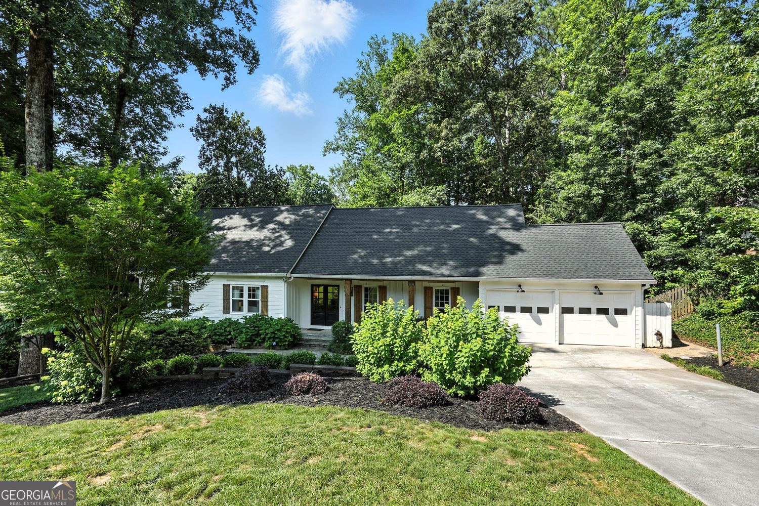 Beautifully updated home in Indian Hills Country Club! Tucked away on a quiet cul-de-sac in one of East Cobb's most desirable neighborhoods, this stylishly updated home offers space, flexibility, and timeless appeal-all in the top-ranked Walton High School district. With 5 bedrooms and 4 full bathrooms, the versatile layout is ideal for multigenerational living or hosting guests. The main level features three generously sized bedrooms, including one that once served as the primary bedroom with a private, en-suite bathroom. The current expansive primary retreat enjoys its own private space upstairs. Light hardwood floors flow throughout the main level, leading you from the separate dining room to the heart of the home: a beautifully renovated eat-in kitchen with an oversized, quartzite island, designer lighting, and high-end appliances, including a deep sink and gas range. Just around the corner is the relaxing family room complete with a vaulted ceiling for architectural interest and a wood-burning stove for cozy nights at home. The daylight terrace level adds even more living space, complete with a fifth bedroom-perfect as a guest suite, home gym, office, or whatever suits your needs. Additional highlights include fully renovated bathrooms, all new LVP flooring on the terrace level, and a brand-new roof for peace of mind for years to come. Thoughtfully designed and truly move-in ready, this home checks every box in one of East Cobb's premier golf course communities.
