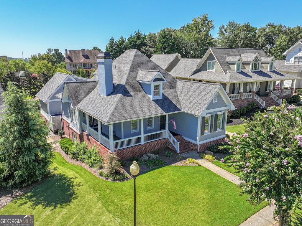 This beautifully updated home in the coveted Village at Chateau Elan offers the perfect blend of elegance, comfort, and resort-style living. On the main level, you'll find a renovated kitchen with breakfast area and adjoining dining space, open to an oversized family room with fireplace-a true centerpiece for gatherings. The primary suite on the main features direct porch access and a renovated spa bath with a rare stone soaking tub that stays warm longer for ultimate relaxation. Upstairs, a huge game/media room and a private bedroom with full bath create the ideal retreat for family or guests. Step outside to enjoy a spacious back porch overlooking the grounds, plus a deck with a hot tub for evening unwinding. The property has been newly landscaped, with fresh exterior and interior paint, and is meticulously maintained inside and out. The separate carriage house apartment provides even more flexibility, complete with a full bedroom, full bath, generous closet space, and its own water heater-perfect for extended guests, a teen suite, or private office. This property also features a covered golf cart bay, a level driveway (rare and highly sought-after!), and an unfinished basement for storage or future expansion. Located in the gated, golf-course community of Chateau Elan, this neighborhood is truly one-of-a-kind. With world-class amenities including multiple championship golf courses, winery & resort, clubhouse dining, tennis, pickleball, and more, it's no surprise that people vacation here-yet you can call it home. Yard maintenance is included, giving you true lock-and-leave luxury in one of the most desirable communities in Georgia.
