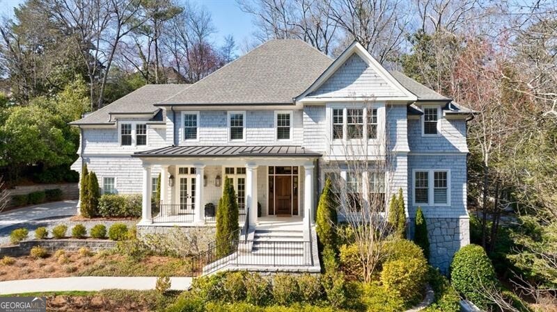 Stunning home on coveted Argonne Drive where no detail has been left untouched. Charming front porch leads to the light filled foyer with herringbone patterned hardwood floor. The front of the house holds a formal dining room and living room. Beautiful kitchen with large island, stainless steel appliances, breakfast area and plenty of storage. The chef's kitchen opens to the family room with gas fireplace and offers views of the pool. Two sets of French doors lead to the covered patio with fireplace and look out to the pool, ideal for entertaining. The patio also has space for a dining table. Off of the two car garage, there is a back staircase, mudroom and side entry. Both staircases lead to 4 spacious bedrooms all with en-suite baths including oversized primary suite with large walk-in closet + island. Gorgeous bath with large shower, dual vanities and separate garden tub. The primary suite has vaulted ceilings and sits in the back of the house. The bonus room is the hidden gem of the house with built in bookcases and access to the back staircase. Basement is unfinished with high ceilings and has access to the side of the house. Great for storage or could easily be finished out. Very well maintained home with close proximity to private + public schools, shops and restaurants.