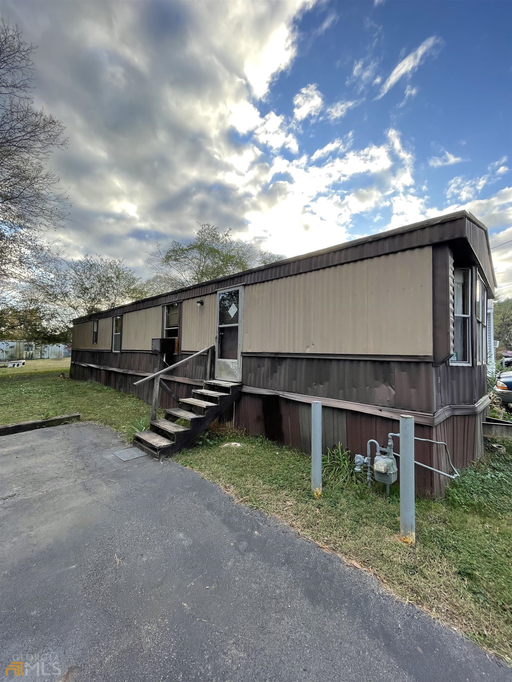 Quaint area to have quick access into town or commute! This mobile home is set on a cul-de-sac corner with a tenured life in the Darlington Mobile Home Village. With 2 beds and 1 bath this could be a great investment opportunity or nice purchase for quiet living. There are two great working window units for AC, the stove and hot water heater are natural gas, a year old GE washer and dryer that stay, and an outdoor shed for additional storage. This will sell "as-is", cash only. SELLER IS VERY MOTIVATED!!!! The park requires $280/month lot rent.