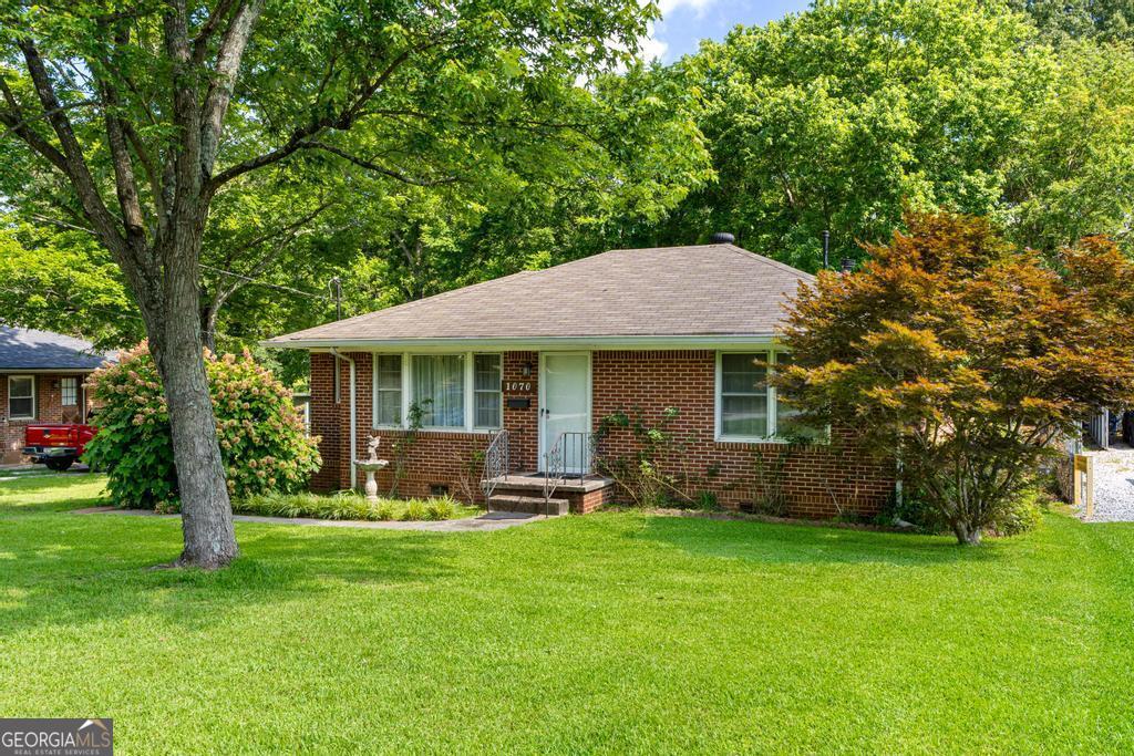Charming 4- Sided Brick Ranch - Prime Forest Park Location! Welcome to this timeless 3-bedroom, 1-bath home in the heart of Forest Park, offered for the first time by the original owner! Built in 1952, this classic all-brick ranch combines vintage charm with unbeatable convenience. Inside, you'll find original hardwood floors and tile that add warmth and character throughout. The thoughtfully designed kitchen offers the perfect layout for home- cooked meals, and the spacious family room is ideal for gatherings and everyday living. Nestled in a well-established neighborhood, this home offers quick access to I-75, I-285, Hartsfield-Jackson Atlanta International Airport, and is just minutes from Downtown Atlanta - making your commute or weekend plans a breeze. Don't miss this rare opportunity to own a lovingly maintained, solid brick home in a prime location. Whether you're a first-time buyer or an investor looking for a gem, this one is a must-see! Call me to schedule a showing.
