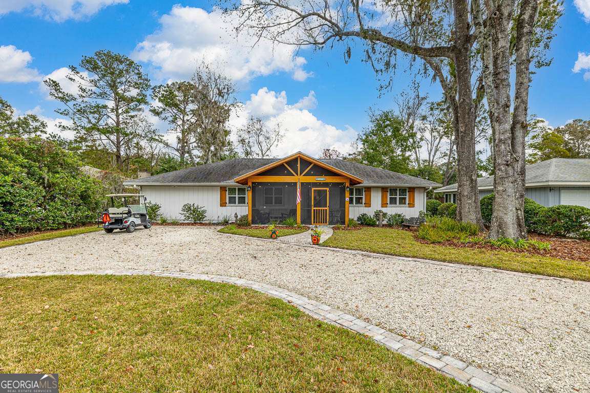 # Coastal Retreat on St Simons Island with amazing income potential!!! Discover this newly listed beach cottage, perfectly timed for summer enjoyment on beautiful St Simons Island with a 4 seater street legal golf cart included!!! This charming 4-bedroom, 3-bathroom home blends modern comforts with coastal charm, creating an inviting space for both relaxation and entertainment. Step onto the welcoming screened front porch, an ideal spot for morning coffee or evening conversations. Inside, the open floor plan bathes the home in natural light, featuring two distinct living areas and a cozy fireplace for cooler evenings. The kitchen stands as a central gathering place with its practical island, elegant quartz countertops, and quality stainless steel appliances. Comfort extends with two master suites, offering privacy and convenience for family or guests. The sunroom provides additional space to unwind while enjoying views of the outdoors. Step outside to find a true island oasis with a large fenced back yard. The saltwater pool invites refreshing dips during warm days, while evenings can be spent gathering around the firepit. The location couldn't be better, with easy access to local shopping, restaurants, beaches, and the village. This St Simons Island home offers the coastal lifestyle you've been dreaming of - relaxed living with all the comforts of home, just in time to create summer memories.