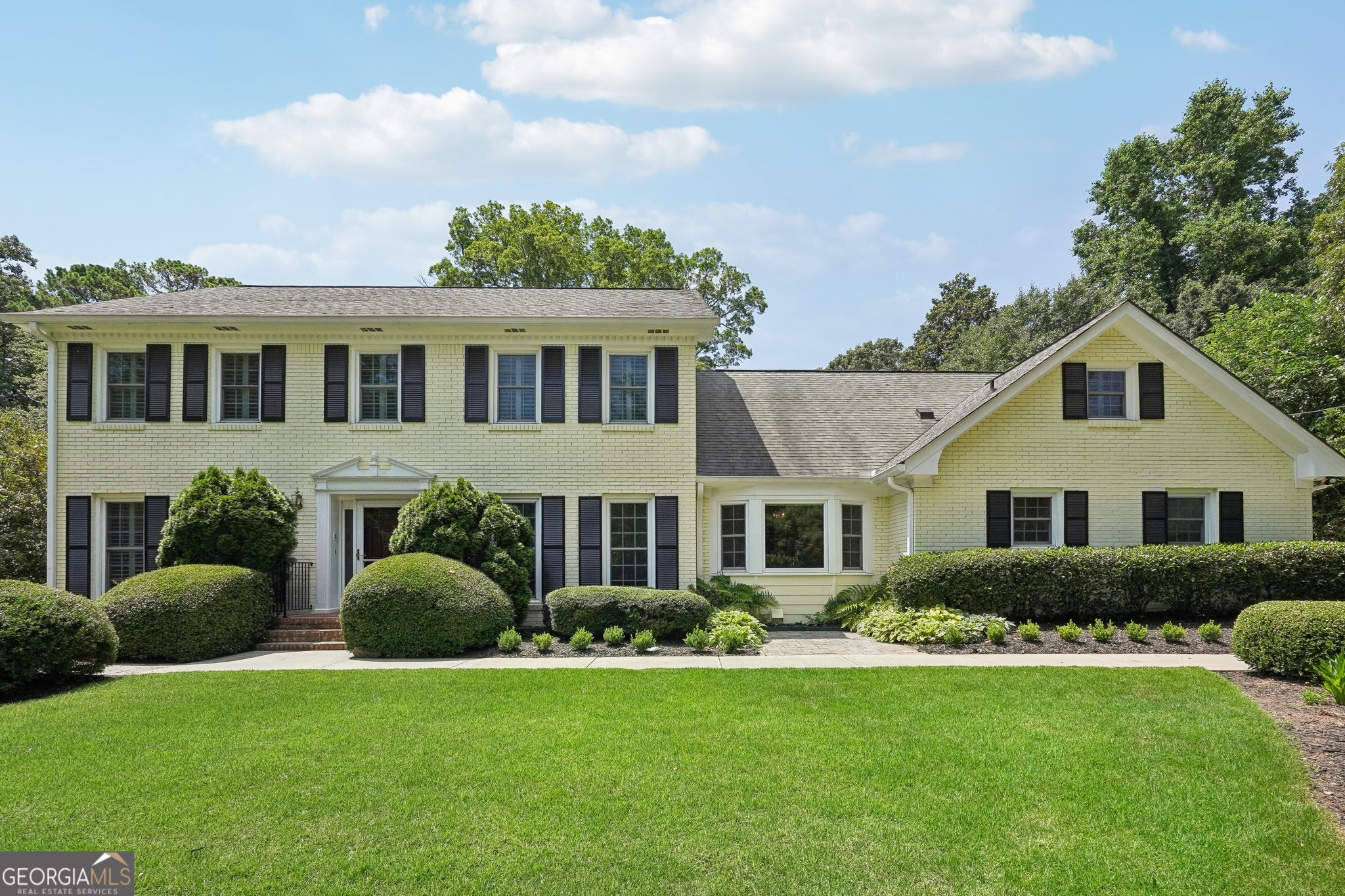 Immaculate outdoor living spaces!!! A gardeners dream home, both front yard and back! Curb appeal off the charts as you drive up to this home. On top of the exterior, you will find a home with double masters and the newest master is on the main. Hardwood floors highlight the man living area along with an open floorplan and a vaulted sunroom that will want you to hang out in all day. The beautiful kitchen features white cabinetry and an eat-in area and a separate dining room. Two sets of stairs will lead you upstairs to the four bedrooms and three full bathrooms. The second master has a walk-in closet and an updated bath. The Bonus room can act as a bedroom, an office or a playroom and has its own full bath. The basement is mostly finished with some unfinished area for the systems and storage. Outside the very private fenced in backyard beckons with its level lot, stone patio, charming fishpond and covered grilling area, providing an idyllic setting for outdoor entertaining or relaxation. Fenhurst is a highly desirable cul-de-sac just walking distance to Brooke Run park and a short drive to the Perimeter Business District and 285.