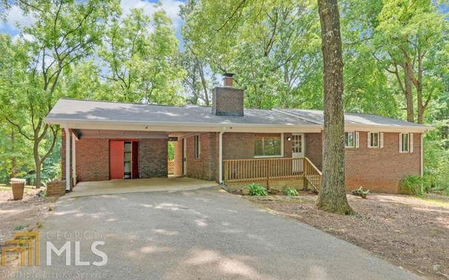 Rural Reality!  5.27 acres located in one of the sweetest parts of N. Georgia offers open garden areas, year round creek, plantation size trees, abundant wildlife and all the peace and quiet you desire. 3 BR/1 1/2 BA brick ranch with partial basement offers fantastic opportunity for additional finished space.  Extras: Long asphalt drive, newer roof and HVAC, extra insulation, well for water self-sufficiency, 200 Amp breaker panel, security wiring, Marathon hot water heater, wood burning fireplace, and a kitchen with tons of cabinet space! Tractor/camper/boat storage building. Fairview area close to Helen, Unicoi, Lakes, National Forest and all the outdoor activities you come to North Georgia for.