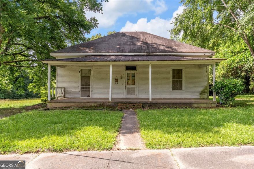 Unlock the potential of this charming 3-bedroom, 1-bath cottage fixer-upper in historic Sparta, Georgia, boasting 1,940 square feet of space waiting for your personal touch. Nestled within walking distance to downtown and the Hancock Historical Society, this property offers a unique opportunity to immerse yourself in an antebellum community rich with character. Enjoy nearby Hamburg State Park and take a short ride to the picturesque shores of Lake Sinclair and Lake Oconee for weekend adventures. With its prime location and endless possibilities, this cottage is perfect for those looking to create their dream home in a vibrant small-town setting. Don't miss out on making this hidden gem your own!