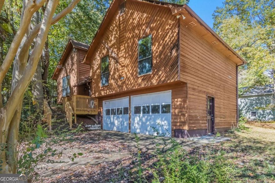 Discover the potential in this 3-bedroom, 2-bath ranch-style home situated on a spacious corner lot in the quiet Indian Springs community of Canton. This property offers a fantastic opportunity for investors or buyers seeking a full renovation project. The home features an unfinished basement, a two-car garage, and a large sloped yard with a distinctive exterior design.    While the home needs extensive updates throughout-including kitchen, baths, and portions of the deck-it offers solid fundamentals and plenty of space to reimagine and restore. Due to its current condition, this home may appeal primarily to cash or renovation-loan buyers. Conveniently located near shopping, dining, and major highways, this property is ideal for those looking to bring new life to a home with great potential and character.