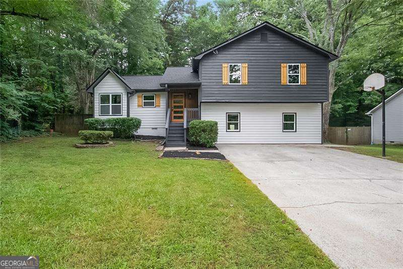 Welcome to 4050 Summit Wood Dr in Kennesaw, where every detail of this beautifully updated split-level home has been thoughtfully crafted for today's lifestyle. With 4 bedrooms, 3 full bathrooms, a finished basement, and over 2,000 square feet of living space, this home offers an ideal blend of function and modern design. The main level boasts an open-concept layout with incredible natural light, leading into a completely reimagined kitchen. Featuring an oversized island, custom cabinetry, premium countertops, designer backsplash, and brand-new stainless steel appliances, the kitchen is both stunning and highly functional. The entire home showcases high-end finishes, new flooring, fresh interior and exterior paint, designer light fixtures, and all-new systems including the roof shingles, water heater and more. The bathrooms are truly showstoppers-modern, elegant, and fully updated with beautiful tile work and upscale fixtures. The finished basement offers flexible living space and can function as the perfect fourth bedroom, guest suite, home office, or entertainment area, complete with its own full bathroom and ample storage. Step outside into a private backyard retreat featuring a newly upgraded in-ground pool with a brand-new liner and pump system-ideal for entertaining or relaxing in peace. Located in a desirable and quiet Kennesaw neighborhood, this home sits within a top-rated school district and is just minutes from shopping, dining, parks, and major highways. Whether you're upsizing, relocating, or simply seeking a stylish turnkey property, this home delivers on every level. Everything is brand new. The layout is open and functional. The finishes are modern and elevated. Seller's offering 1 year home warranty from a home warranty company up to $1,000! This is the one you've been waiting for!