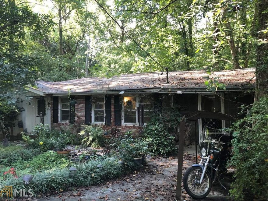 Prime Brookhaven location. .8 acre lot. Great for builders and or investors. Lot does have some stream buffers, but is not in a flood. This is a full scale renovation if that's the direction you choose. Comps for 3/2's in the area are in the 500's. New construction going for 1M plus in the area. House is being sold and priced As-Is, No Disclosures.