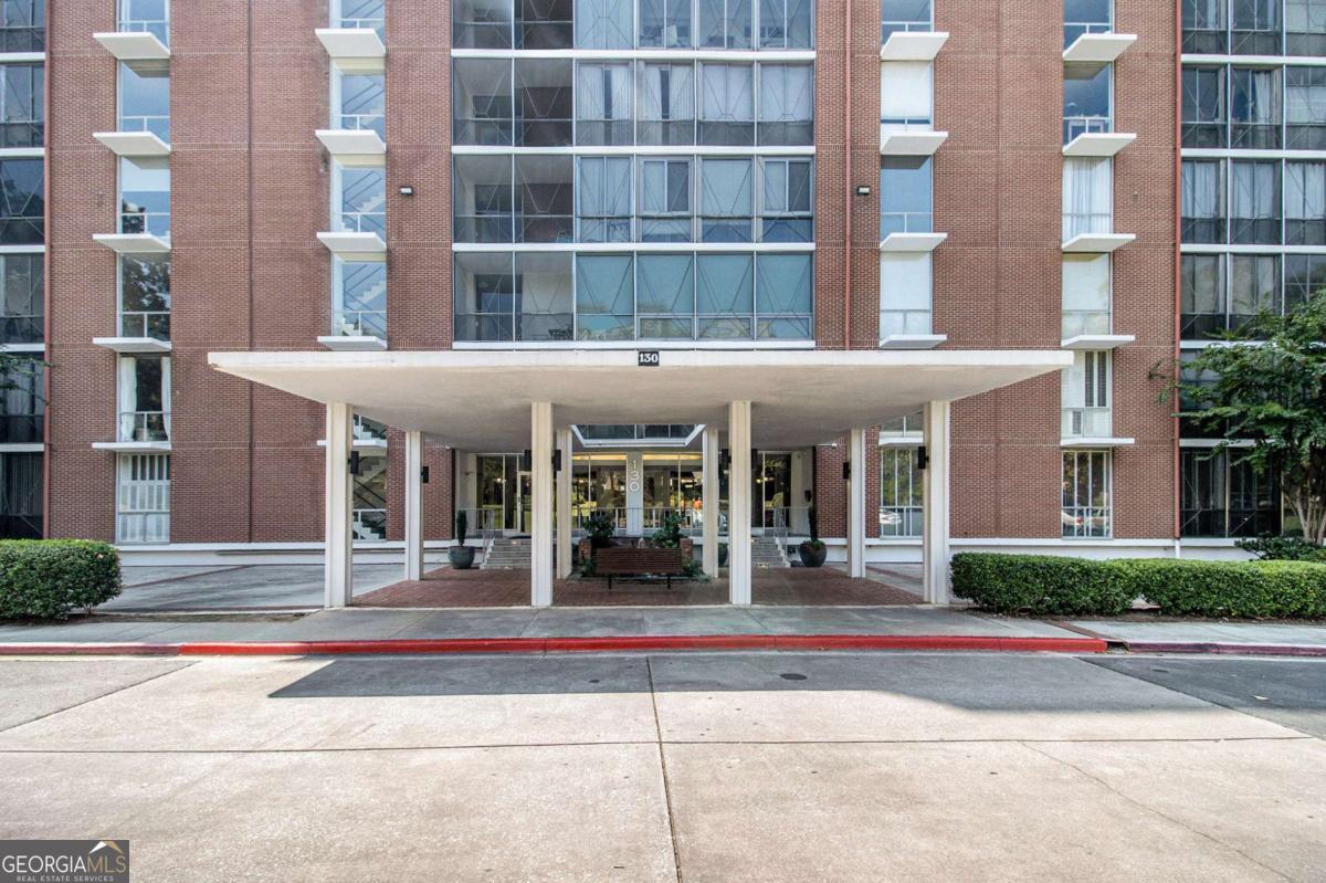 Perfectly situated between Buckhead and Midtown, this spacious 1-bedroom, 1-bath Mid-Century Condo features a large, open living area filled with natural light from floor-to-ceiling windows. A bright sunroom offers the perfect spot for a home office or workout space. Secured gated parking, and ample visitor spaces, pool, and tennis courts-all in a serene, tranquil setting. Offering the perfect blend of city living with a peaceful setting, within walking distance of Beltline, shops & restaurants.