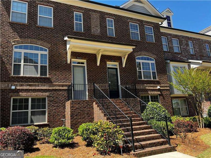 This beautifully maintained townhouse, located in a secure gated community, features a spacious and functional layout ideal for modern living. The main level welcomes you with an open-concept design that includes a generously sized kitchen with stainless steel appliances, overlooking the dining area and a cozy family room with a fireplaceCoperfect for entertaining or relaxing.  On the entry-level, you'll find a versatile third bedroom with a full bathroomCogreat for guests, a home office, or an in-law suiteCoalong with a convenient two-car garage with front entry.  Upstairs, the luxurious OwnerCOs Suite features a tray ceiling, an expansive walk-in closet, dual vanities, an oversized shower, and a soaking tub. The second upstairs bedroom also includes a private en suite bathroom and a walk-in closet, offering comfort and privacy.  Located in a walkable neighborhood with quick access to GA 400, this home is just minutes from premier shopping, dining, and everyday conveniencesCoan ideal blend of comfort, style, and location.