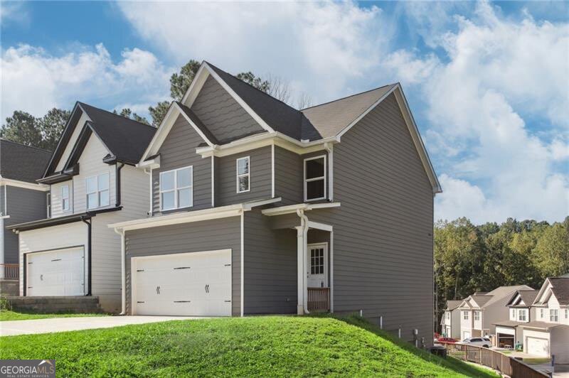 Welcome to the sought-after Hood Villas community! This beautifully designed 2-story home checks every box buyers are looking for. From the moment you step inside, you'll notice the bright, open layout that makes entertaining and everyday living effortless. The kitchen is the heart of the home, featuring granite countertops, stainless steel appliances, a pantry for extra storage, and a stylish island that flows right into the dining and living spaces. Off the main level, an elevated deck offers the perfect place to relax or host friends while enjoying peaceful views. Upstairs, the primary suite feels like a private retreat with its spa-inspired bath-complete with a soaking tub, glass shower, dual vanities, and an expansive walk-in closet. Two additional bedrooms share a convenient Jack-and-Jill bath, and the laundry is thoughtfully placed upstairs for easy access. The daylight walk-out basement is a true game-changer. Stubbed for a bathroom and filled with natural light, it's ready to be transformed into an in-law suite, game room, private gym, or home office-the possibilities are endless. And the location? Unbeatable. You're just minutes from downtown Jasper, where you can grab coffee at a local cafe, enjoy dinner at one of the town's favorite restaurants, shop charming boutiques, or take in live music and seasonal festivals-all with the stunning backdrop of the North Georgia mountains.