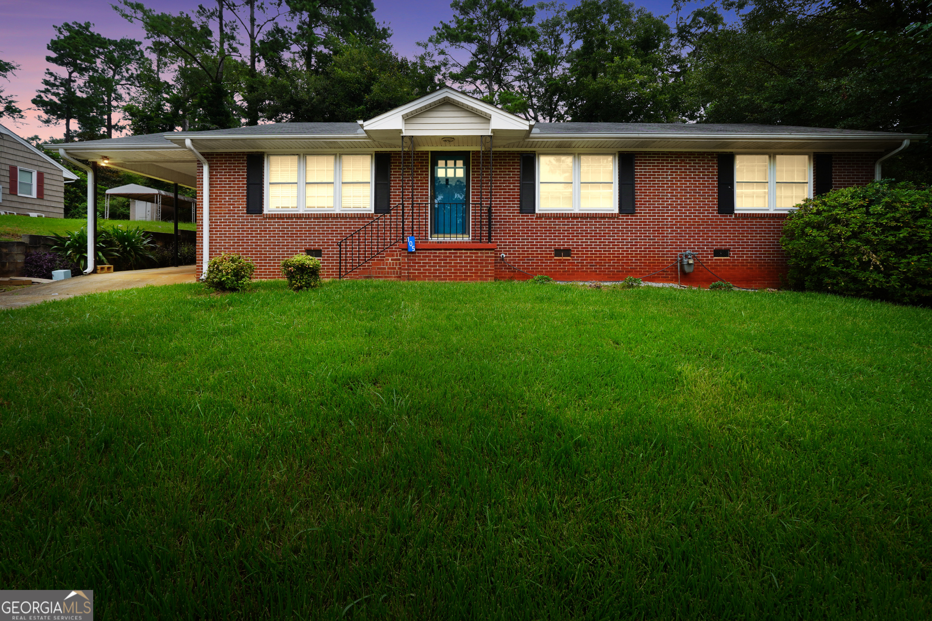 Motivated Seller- Make an Offer!! Welcome to 105 Upson Ave in Thomaston! This charming 3-bedroom, 2-bath brick home offers timeless curb appeal with a 4-sided brick exterior, one-car carport, and a fully fenced backyard. Inside, you'll find a spacious living room with beautiful hardwood floors, a brick fireplace, and custom built-in bookshelves. The eat-in kitchen includes a solid surface cooktop, wall oven, refrigerator, and plenty of cabinet space for storage. The layout also features a flexible bonus room off the primary bedroom, perfect for a nursery or oversized walk-in closet. Home offers additional bedroom and office space.