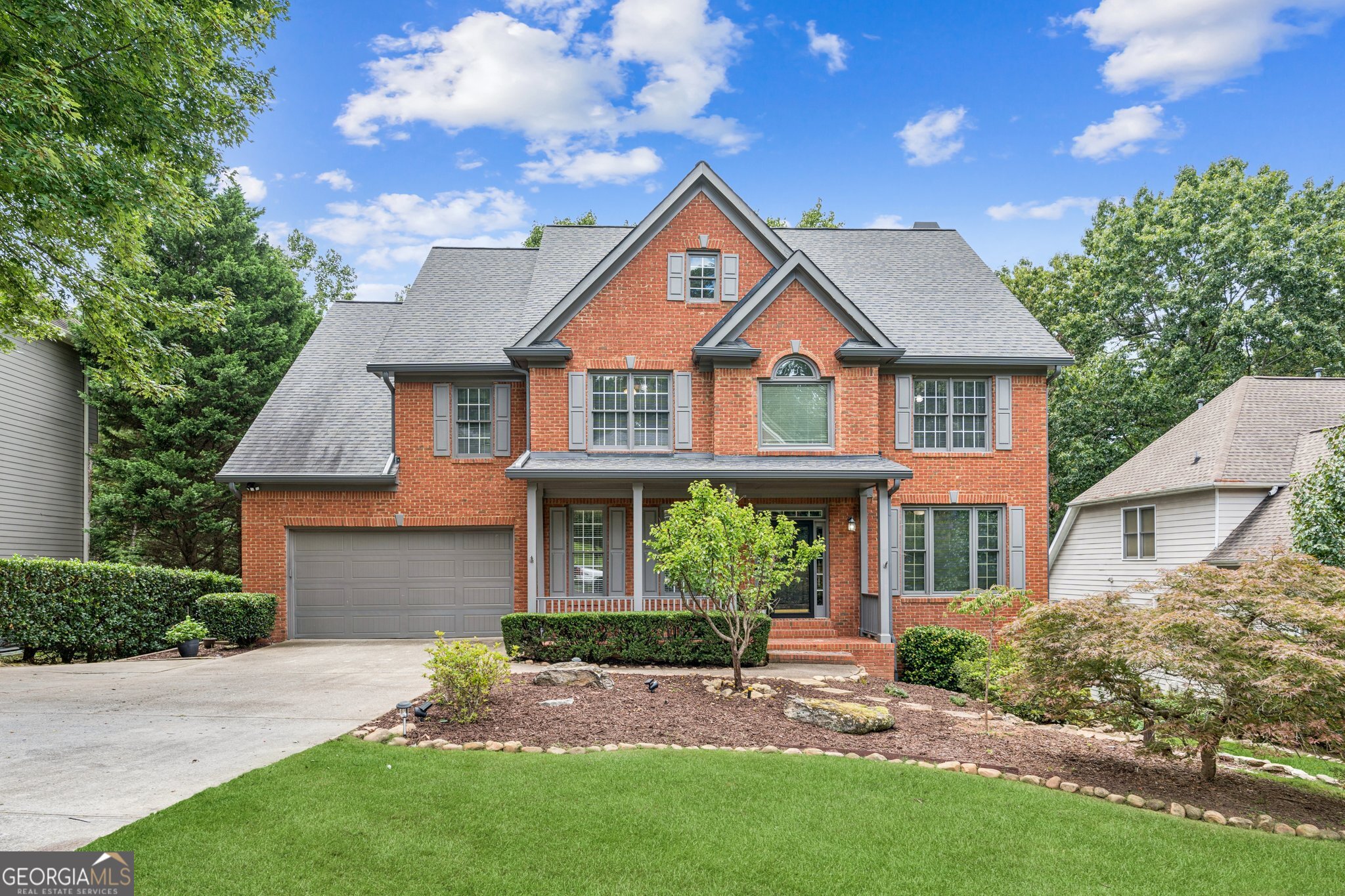 Welcome to 6625 Ridgefield Drive! This home has everything you've been looking for, an Alpharetta address with the bonus of lower Forsyth County taxes. Inside, you'll find gorgeous newer LVP hardwood floors throughout, a bright two-story foyer, cozy built-in bookshelves, updated stair balusters, and a private office that's perfect for those Zoom calls. The renovated kitchen features stainless steel appliances, a walk-in pantry, an island great for entertaining, stone countertops, tile backsplash, and plenty of space for cooking, gathering, or late-night snacking. Hosting's a breeze with not one, not two, but three awesome outdoor spaces. You'll love the private covered patio off the kitchen, the deck off the living room, and the newer covered lower deck that was added when the basement was finished in 2022. Downstairs also has tons of storage, a bedroom with a private entrance, and a large walk-in bathroom with a shower big enough for the whole family! Upstairs you'll find four spacious bedrooms, three full bathrooms, and a walk-in laundry room that actually makes doing laundry feel easier. One bedroom has its own private en-suite, two share a Jack-and-Jill bath, and the primary suite is a total retreat with dual vanities, a whirlpool tub, separate shower, and a generous his-and-hers walk-in closet. Newer LVP flooring continues upstairs for a clean, modern feel. The backyard is private and fully fenced, perfect for a swing set, garden, pets, or just relaxing with a good book. All HVAC systems are less than 4 years young. And let's talk about location, great schools like Big Creek Elementary, Desana Middle, and Denmark High School. Plus, this neighborhood is packed with fun. Enjoy a community pool, clubhouse, tennis courts, pickleball, and events like movie nights, a Fourth of July parade, a fall festival with a petting zoo, and even a Cookie Night with Santa and more. Come take a look, fall in love, and make it home.