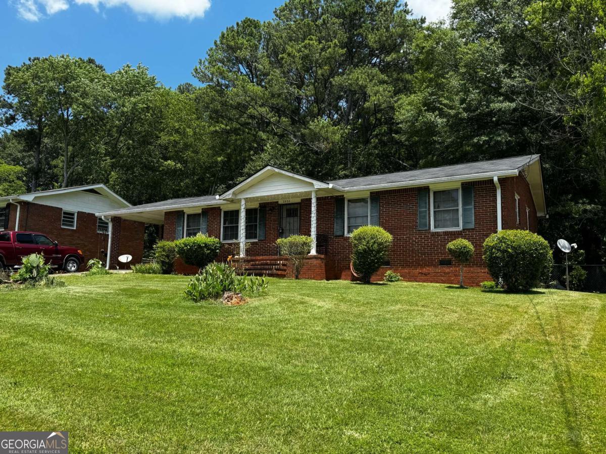 Well-maintained 3 bed, 2 bath brick ranch in desirable East Point location! Offers 1,492 sq ft of comfortable living space with open layout, large lot, and solid mid-century charm. Clean and livable - perfect for a rental, light cosmetic flip, or long-term hold. Major systems in good shape: central HVAC updated last year, 10-year-old 3-tab roof, 10-year-old water heater. Off-street parking. Opportunities like this with strong potential and great location don't last long - act fast to secure this deal!