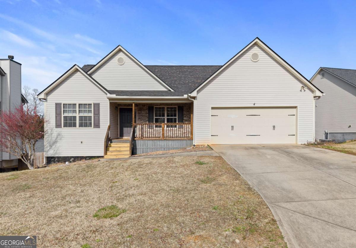 Welcome to your new home in the heart of Dawsonville! This 5-bedroom, 3-full-bathroom ranch-style property offers the perfect blend of comfort and convenience. The main level features a spacious layout, while the full, finished basement includes an additional kitchen and laundry room, ideal for multi-generational living or rental opportunities. The fenced backyard with a play-set that remains with the sale. Recent upgrades include a new roof (2022) and new HVAC system (2023) on the main level, ensuring a worry-free move-in experience. The garage door opener and main level dishwasher were also replaced in 2024. With no HOA and no rental restrictions, this home is perfect for homeowners and investors alike. Plus, youCOll love the convenient location near Dawson High School and Downtown Dawsonville, with access to public water and sewer services. This is a rare opportunity to own a property with so much flexibility and charm in an ideal locationCodonCOt let it slip away!