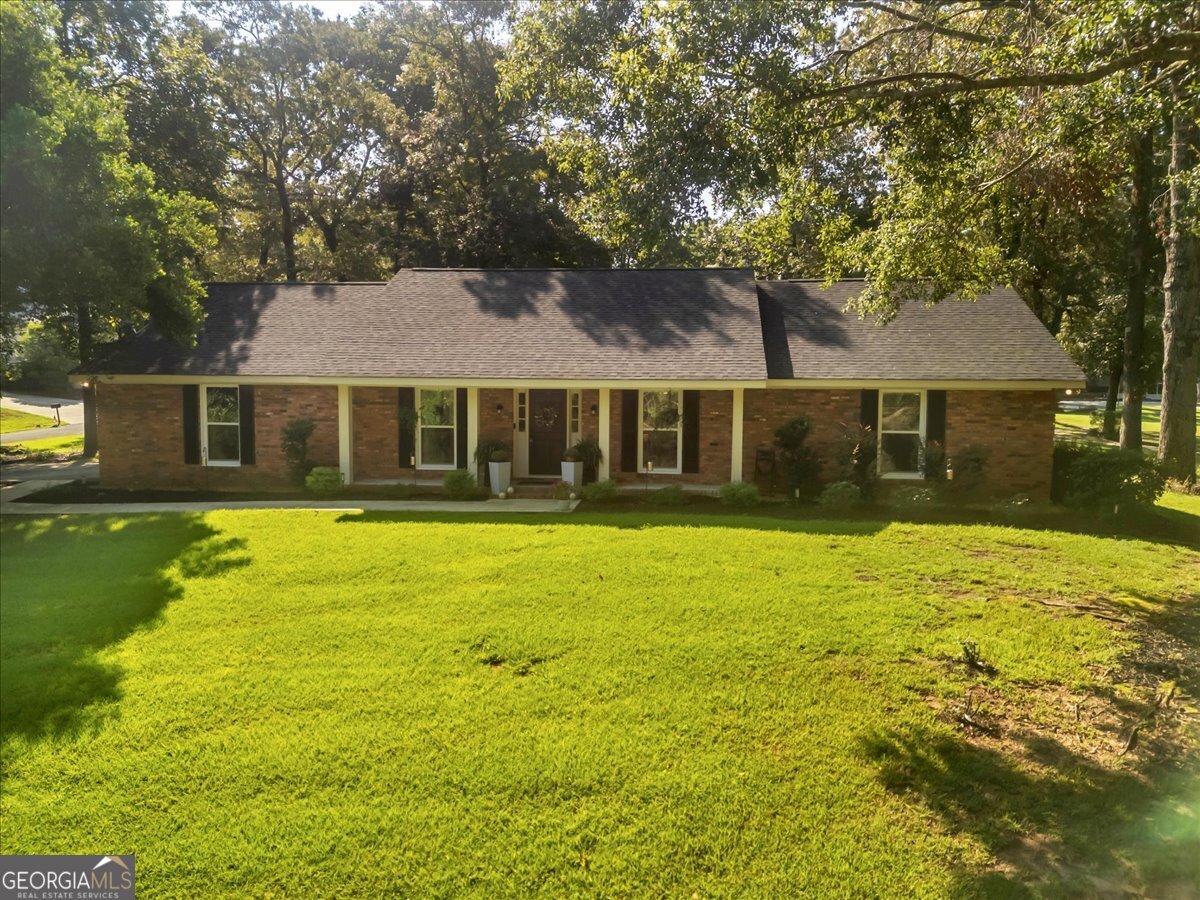 **Showings will begin at Open House on Thursday 8/28 from 5 - 7 pm** Welcome to 254 Trinity Road, a beautifully renovated 3-bedroom, 2-bath ranch that blends timeless charm with modern comfort. This picture-perfect brick home has been immaculately maintained, showcasing lovely landscaping and a tranquil pond setting. Inside, you'll enjoy a spacious floor plan and a luxurious primary suite featuring a spa-inspired bath with a tiled shower and separate soaking tub. Step outside to the fenced backyard, complete with a patio and screened-in porch - the perfect backyard for entertaining or enjoying peaceful solitude. Conveniently located in Laurens County, this home offers the serenity of a quiet neighborhood while still just minutes from the city center