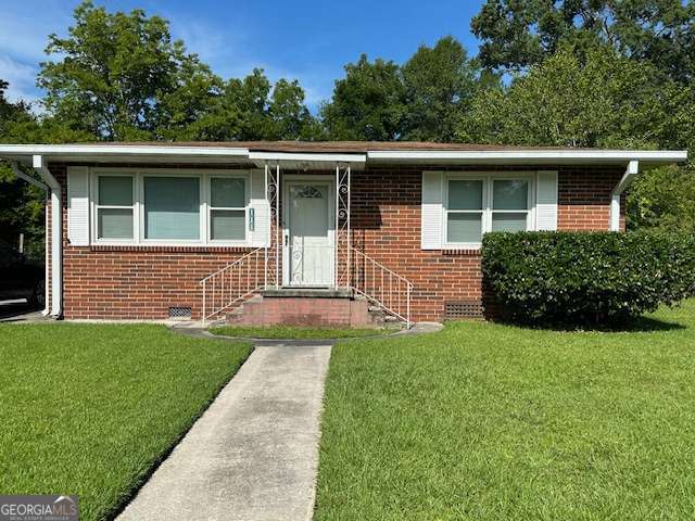 Charming Bungalow in Port Wentworth! Welcome to this adorable 3-bedroom, 2-bath home offering 1,154 square feet of comfortable living space. Nestled in a quiet neighborhood, this property is ideal for families, first-time buyers, or anyone looking for cozy Southern living. Enjoy the convenience of a single-car carport at the rear of the home, along with a spacious 2-car garage/workshop-perfect for projects, hobbies, or extra storage. Inside, you'll find an inviting living room complete with a big screen TV and electric fireplace, creating a warm and relaxing space to unwind. The fully fenced backyard is great for pets or outdoor activities, and the location couldn't be better-just minutes from GA Ports and Gulfstream. Don't miss your chance to own this delightful bungalow-it won't last long!