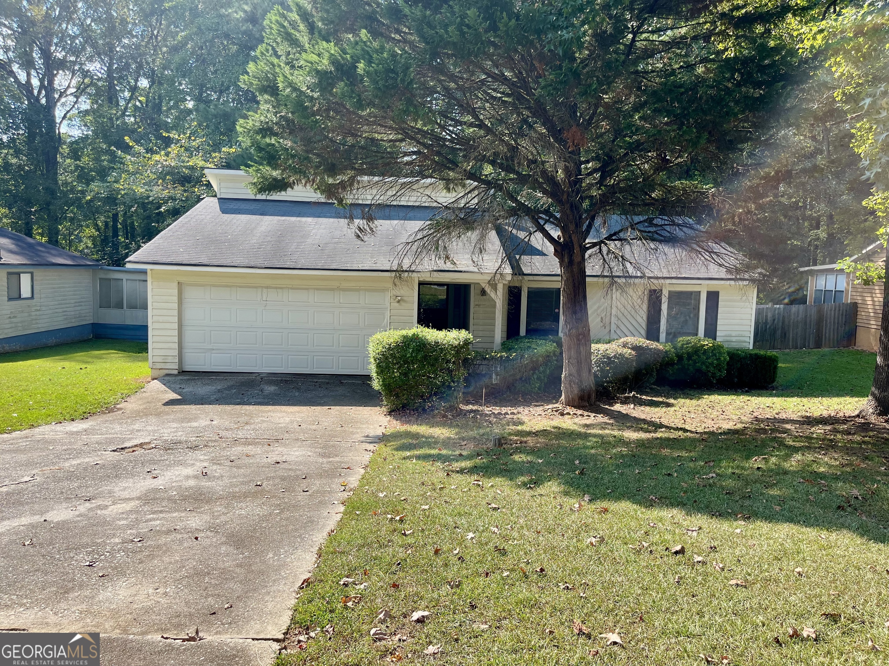 Charming Bungalow Welcome home to this cozy bungalow a welcoming covered front porch-perfect for morning coffee. Inside, the comfortable living room centers around a decorative-only fireplace for extra charm. The home sits on a mature, wooded lot offering shade and privacy,