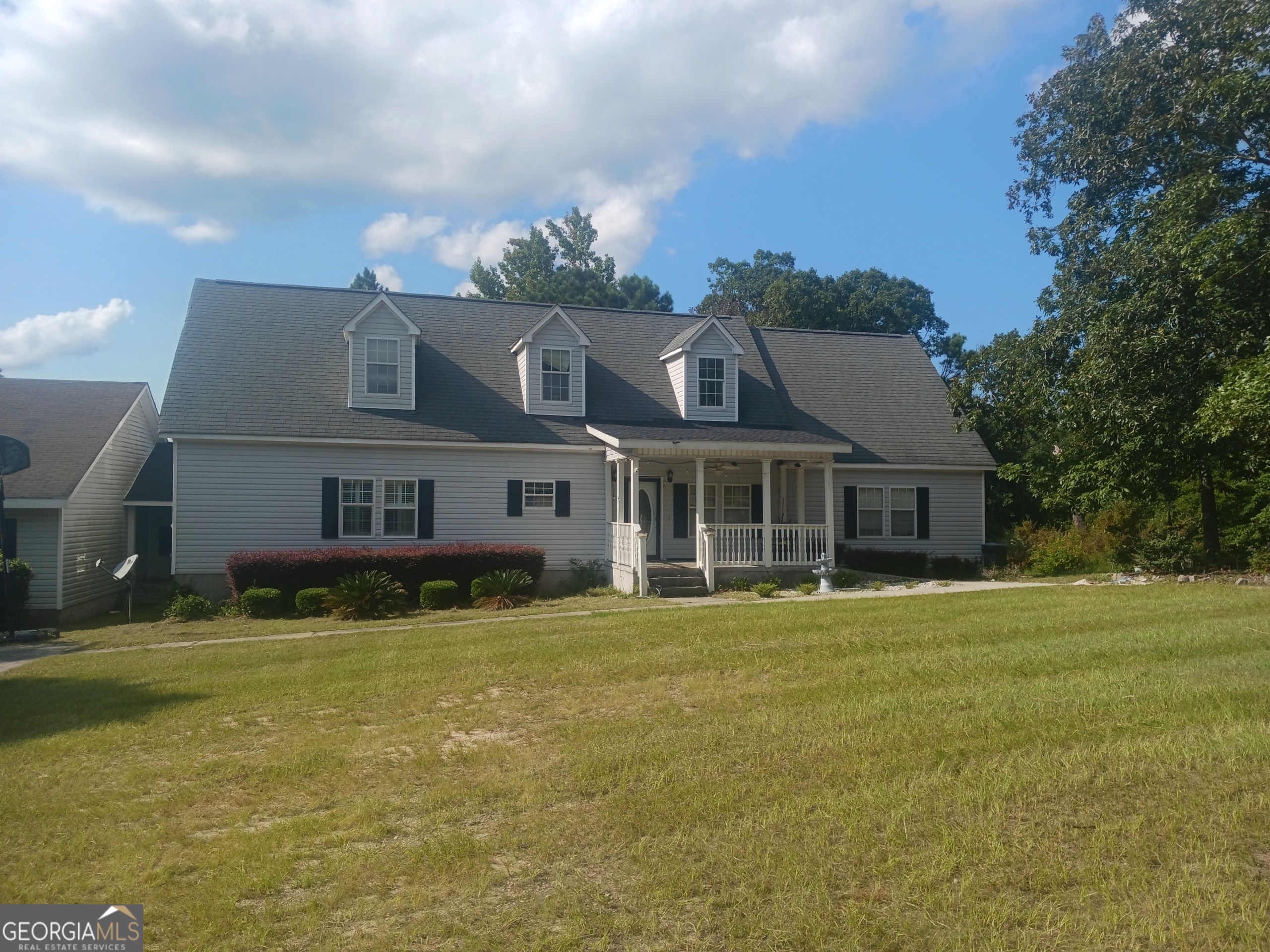 Welcome home to this one-of-a-kind 5+ acre property with 5 bedrooms, 4 baths, and a private in-law suite, making it perfect for family, guests, or multi-generational living! While this home has a Sparta address, it's conveniently located just half a mile from the Baldwin County line, offering quick access to Hancock, Washington, and Baldwin Counties. With over 5 acres, this spacious property provides endless opportunities to create the lifestyle you've been dreaming of. Step inside to find a thoughtful split floor plan; the owner's suite sits privately on one side, complete with a large bathroom and a relaxing jacuzzi tub, while two additional bedrooms are located on the opposite side. Upstairs offers even more space with two oversized rooms, perfect for a home office, game room, or additional living area, plus a tucked-away fourth bedroom. The home also includes a full in-law suite, accessible from the side-entry two-car garage. The suite features its own kitchen, bathroom, and living space - ideal for family, guests, or multi-generational living.
