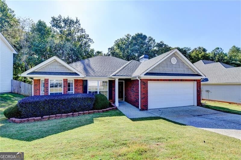 Photo of 2068 Wildcat Cliffs Lane, Lawrenceville, GA 30043 (MLS # 10872851)