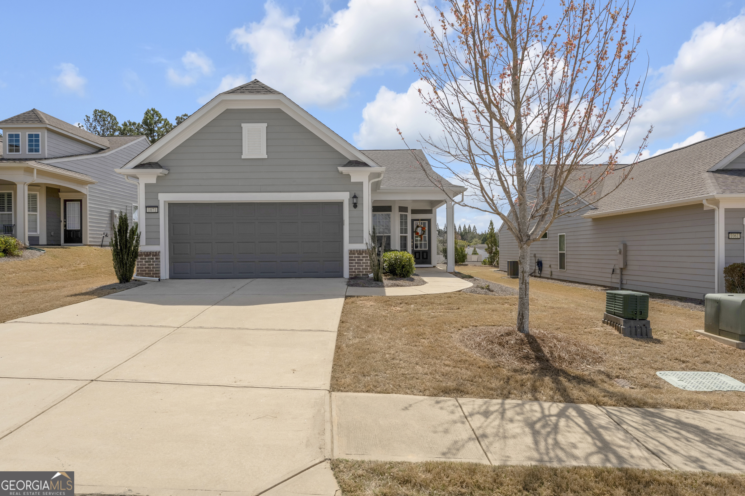 Meticulously maintained and move-in ready, this 2-bedroom, 2-bathroom home with a private office and sunroom offers 1,596 square feet of open-concept living in Del Webb at Lake Oconee, the area's premier 55+ active adult community. The bright, functional layout includes a well-appointed kitchen with modern appliances, roll-out drawers, and ample storage, opening into a spacious living area. The light-filled sunroom overlooks the landscaped yard, while the dedicated office provides flexibility for work or hobbies. The private primary suite features its own en-suite bath, and the second full bath includes a walk-in tub for added accessibility. Additional highlights include a whole-home water softener and low-maintenance finishes throughout. Residents of Del Webb at Lake Oconee enjoy resort-style amenities, including a private marina with boat storage and kayak launch, indoor and outdoor swimming pools, a fitness center, tennis, pickleball, and bocce courts, and a clubhouse with year-round events and activities. The community is conveniently located near Lake Oconee's boating, fishing, golf, shopping, and dining, as well as the charming town of Greensboro. This property offers an ideal opportunity for those seeking a primary residence, a downsizing option, or a lock-and-leave retreat within one of Georgia's most desirable active adult communities. Schedule a private showing today.