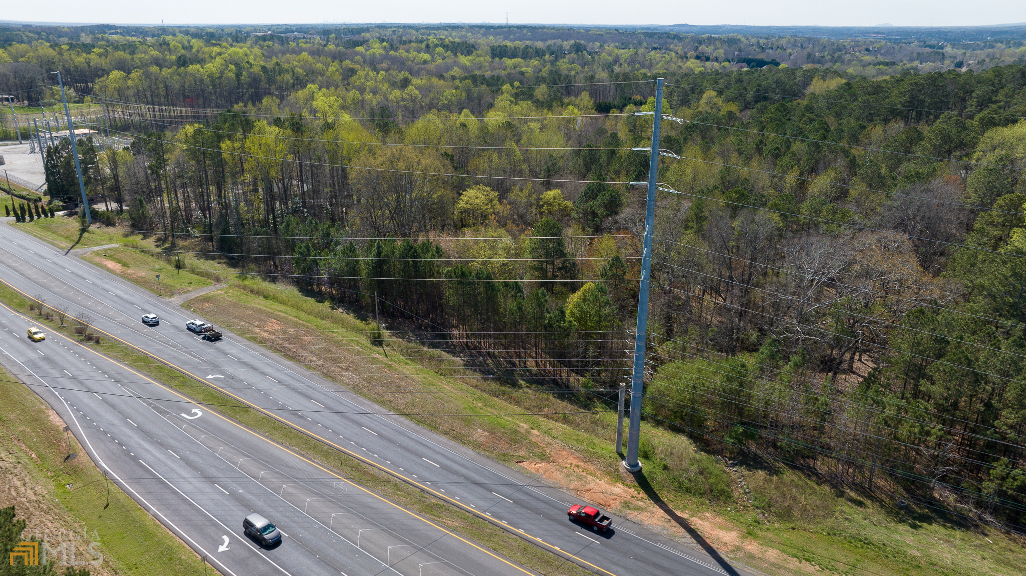 Highly visible 5.01 acre, level parcel, zoned CBD (Commercial Business District) on Peachtree Parkway (SR-141) in Cumming with 430 feet of road frontage and daily traffic count of 40,181 (2022).    Ideal for a variety of uses, including Senior Housing, Self-Storage, Medical, School, Daycare, places of Worship, Retail or Offices.  The site is serviced by public water and electric, sewer and gas nearby.