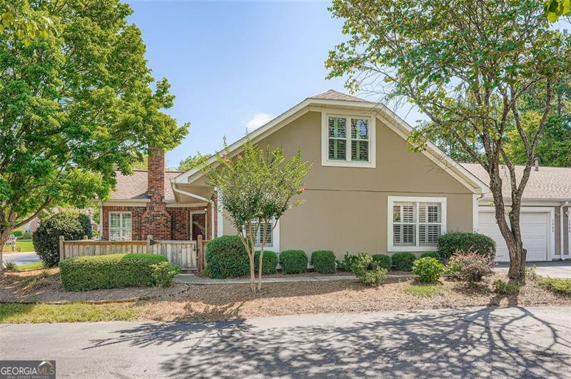 Welcome to this beautifully upgraded patio home condominium in a highly sought-after community just minutes from Kennesaw Mountain National Battlefield Park hiking trails and Marietta Square. Featuring hardwood floors throughout, new granite countertops, stainless steel appliances, and freshly painted walls and cabinets, this home offers modern elegance and comfort. The open floorplan with vaulted ceilings creates a spacious, airy feel, highlighted by a cozy stone fireplace and a private patio perfect for relaxing or entertaining. The main level includes a master and secondary bedroom, while the finished bonus room upstairs adds a third bedroom and full bath, ideal for guests or a home office. Enjoy the convenience of a two-car garage and HOA-managed exterior maintenance. Community amenities include a pool, clubhouse, and fitness center. With no age restrictions, this home is perfect for anyone seeking a maintenance-free lifestyle. Don't miss this exceptional opportunity!