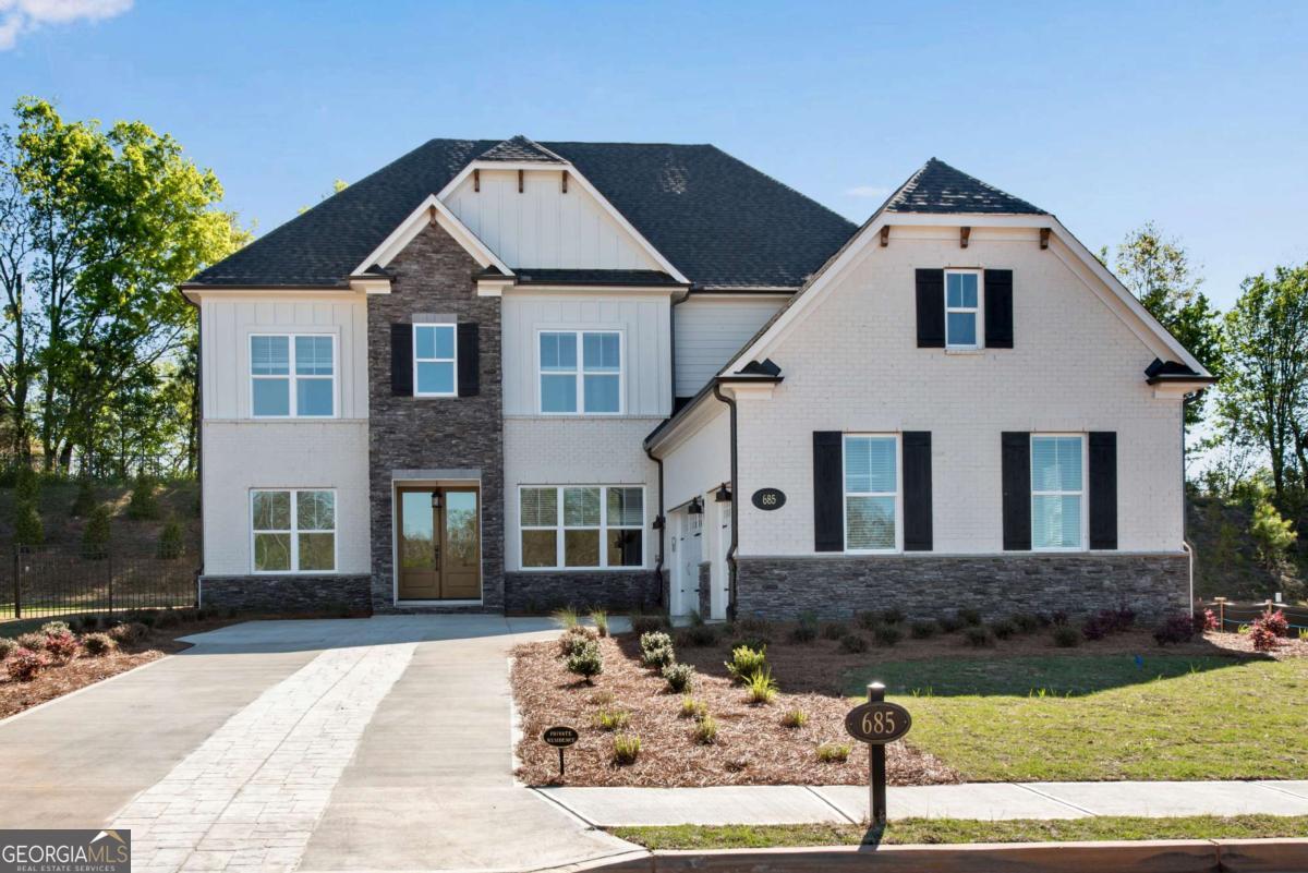 Use google GPS: 685 Old Alpharetta Rd, Alpharetta, GA 30005...Check on zillow or 3D tour and floor plan guide. CURRENTLY HAVE 2 HOMES RENTED, CAN SELL TO INVESTOR Great opportunity to own a brand new expansive designer home with $188441 in design upgrades and $100,000 lot premium in the idyllic location with an Alpharetta address and Forsyth county taxes. This home combines the airy brightness of a modern farmhouse by pulling out natural wood tones with the lighter surround on top of a spacious double lot yard, with a emphasis on luxury with its contrasting deeper palates and stone accent. This luxury home comes with 10ft ceiling on main with private bathroom for every bedroom including an in-law bedroom on main. Outside the home you will find a double lot size being the largest in the neighborhood providing enough space to build a swimming pool and entertainment area if desired, and an irrigation system for your convenience. The oversized yard, and beautiful yet hardi Luxury plank flooring and a private community lake provides the perfect environment for raising kids and entertaining guest in the heated Alpharetta market. #7 Brookwood Elementary #10 Piney Grove Middle(USNews) This home is located in the new(2018) state of the art Denmark High School district. This high school is ranked 26th and improving. The school district has 10/10/9 test scores on Great Schools. Proximity to Alpharetta provides endless opportunities for entertainment, work opportunities, and appreciation. Community lake is deeper into the neighborhood. Listing agents speak Russian, Chinese, Spanish, and English