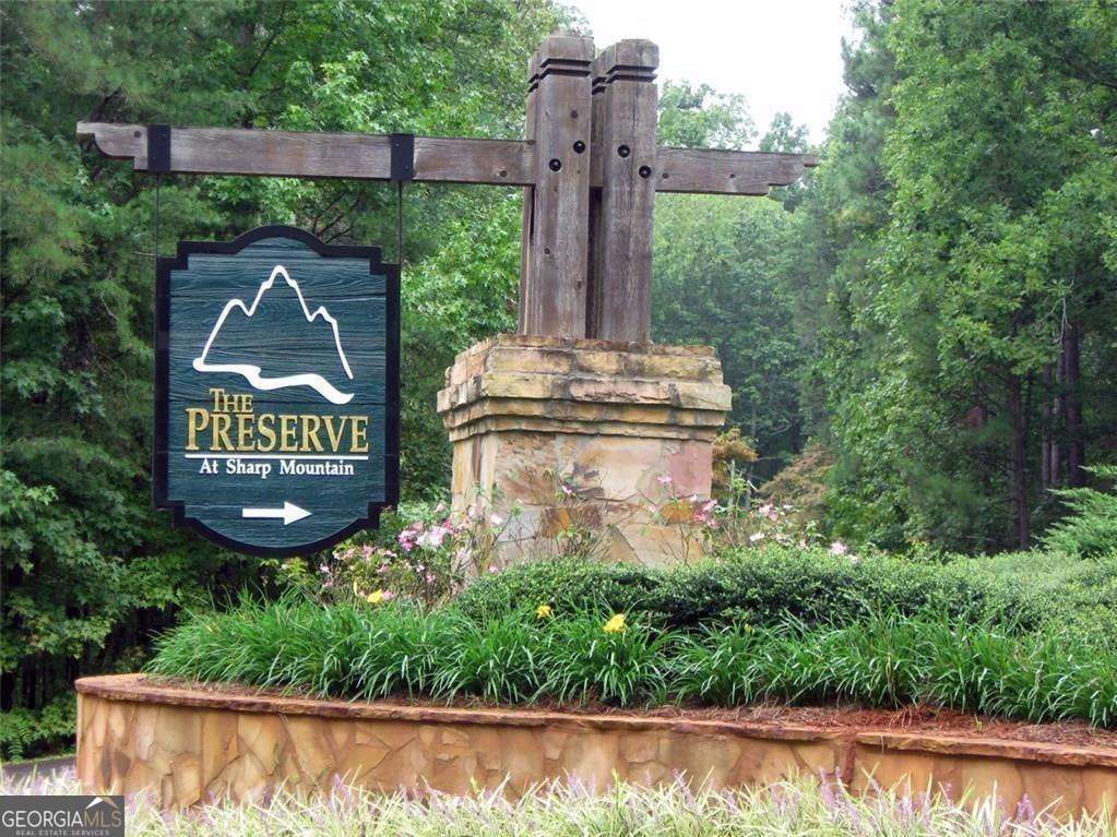 Build Your Dream Mountain Home with Spectacular Views in Jasper, Georgia Are you searching for the perfect private retreat to build your mountain dream home? Look no further than this serene 4.52-acre lot, offering unparalleled opportunities to enjoy nature and breathtaking vistas. Nestled at an elevation of nearly 1,900 feet, this gently sloping lot is ideal for a basement home and features majestic, towering oaks lining the sides and back of the property. The lot boasts stunning long-range mountain views from the rear and enchanting panoramas on the right side, providing picturesque settings for both sunrise and sunset. The terrain slopes beautifully, making it perfect for exploration on foot or creating switchback trails for four-wheelers. Whether you're seeking adventure or tranquility, this lot delivers. The peaceful community offers an array of amenities to enhance your lifestyle: Hiking trails that wind through lush, wooded landscapes. Parks and picnic areas, including gazebos and a spacious pavilion perfect for family gatherings. Creeks and natural beauty that invite relaxation and connection with nature. This hidden gem is conveniently located just minutes from hospitals, shopping centers, and the charming downtown Jasper area, where you'll find local restaurants, boutiques, and year-round community events. Now is your chance to make it your own and build a home where you can enjoy mountain breezes, starry nights, and the best of what Jasper, Georgia, has to offer. Don't just take our word for it-visit the community and speak with the friendly residents who will tell you why they love living here. Act quickly-this unique opportunity won't last long!