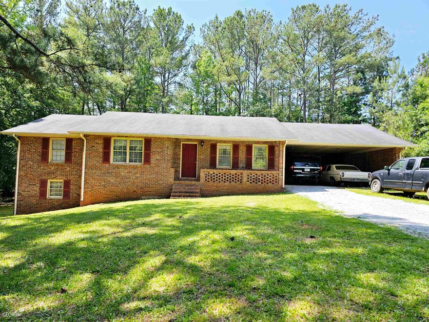 ***3/2 SITTING ON .99 ACRES WITH FULL UNFINISHED BASEMENT***THIS HOME  IS MOVE IN READY AND MAY NEED A LITTLE TLC BUT THAT IS STRICTLY BASED ON THE BUYER AND THEN YOU WILL HAVE A BEAUTIFUL WELL BUILT HOME SITTING ON A NICE QUIET DEAD STREET***BACK DECK IS COMING OFF OF HOME THIS WEEK AND WILL HAVE A NEW ONE NEXT WEEK***LARGE FAMITY ROOM, KITCHEN & DINING ARE CONNETED, 3 BEDROOMS & 2 BATHROOMS, LAUNDRY ROOM & 2 CAR CARPORT***FULL UNFINISHED BASEMENT WITH BOTH INTERIOR & EXTERIOR ENTRANCE***FINISHED OUT THIS HOME WOULD BE GREAT FOR A LARGE FAMILY OR 2 FAMILIES***HOME IS A WELL BUT COUNTY WATER IS AVAILABLE JUST NOT HOOKED UP***PLEASE SEE SHOWING INSTRUCTIONS***